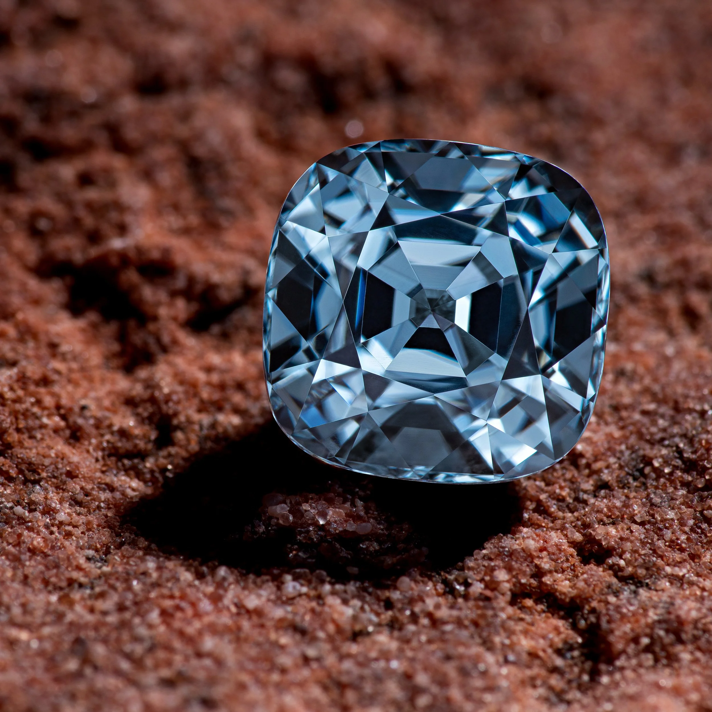 4.42ct_Gray_Spinel_Cushion on sandstone background