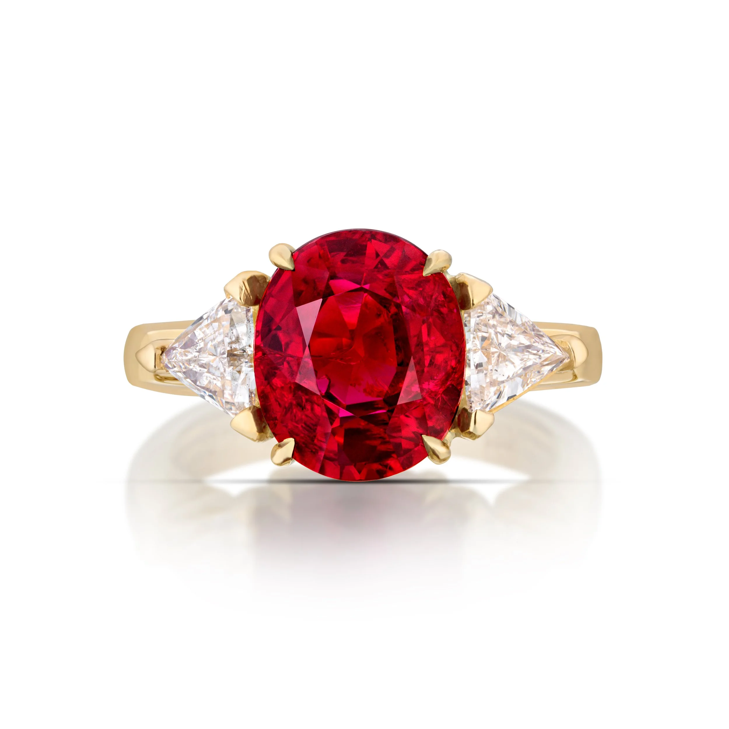 4.08 carat oval Ruby and diamond ring set in 18 karat yellow gold. 