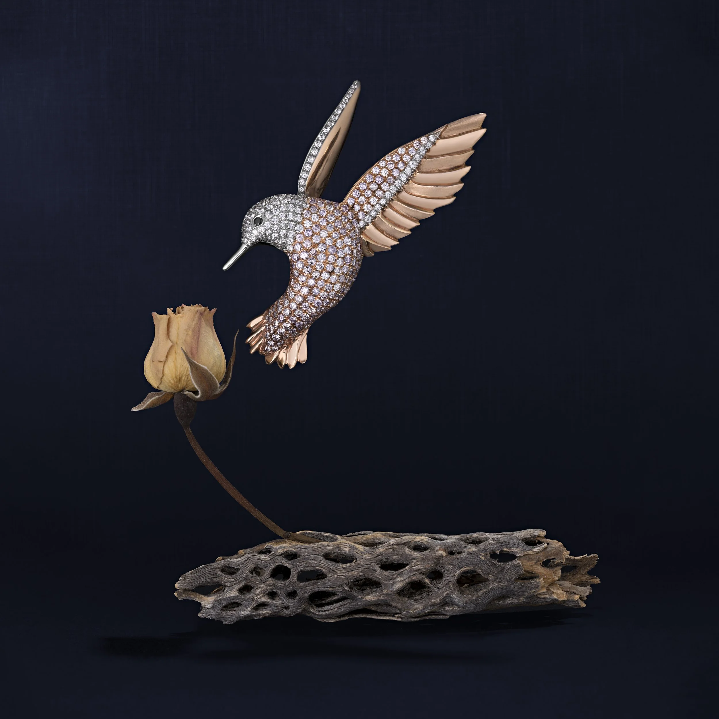Diamond and rose gold hummingbird brooch. 