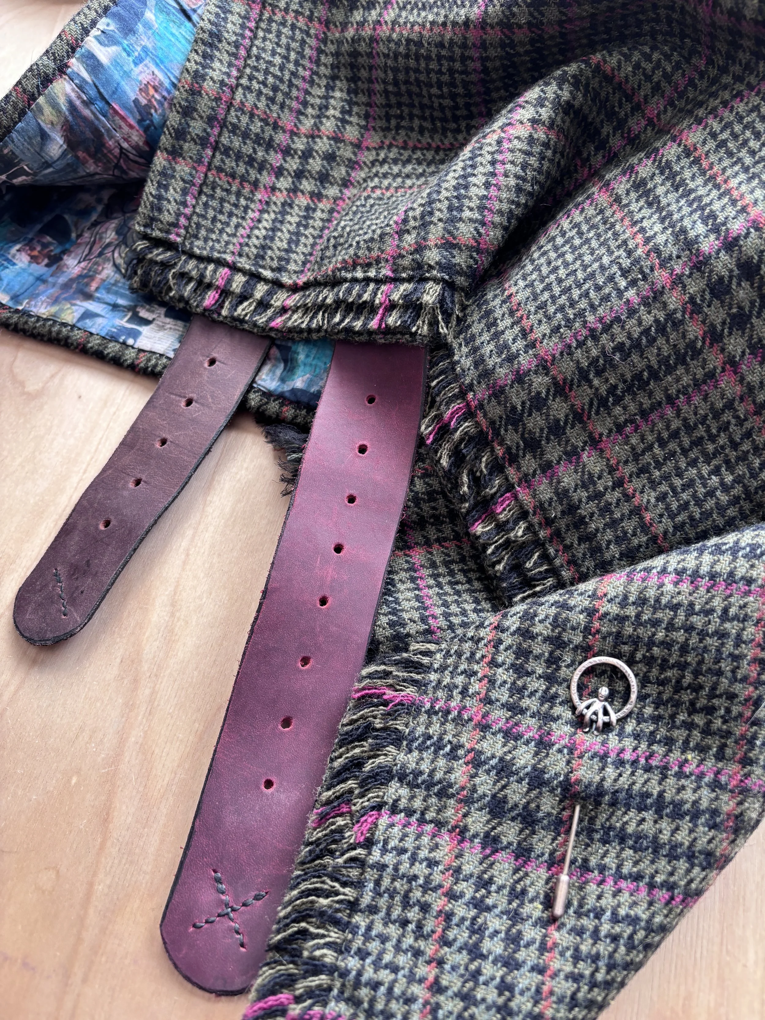 Tweed kilt with pink and brown leather straps