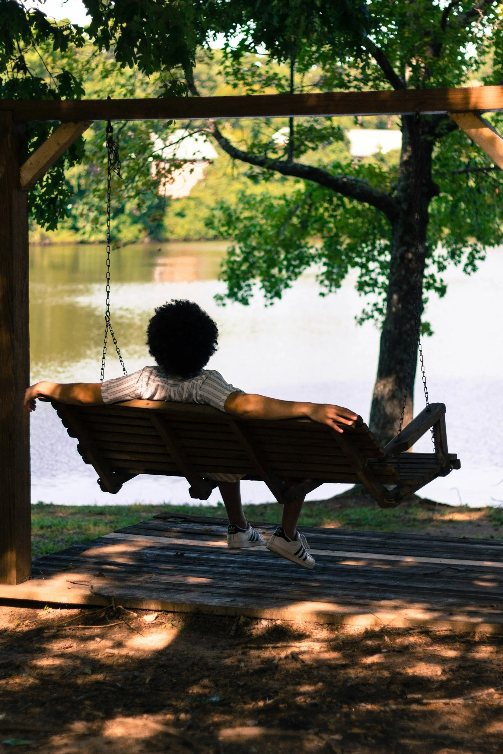 man in swing relaxed