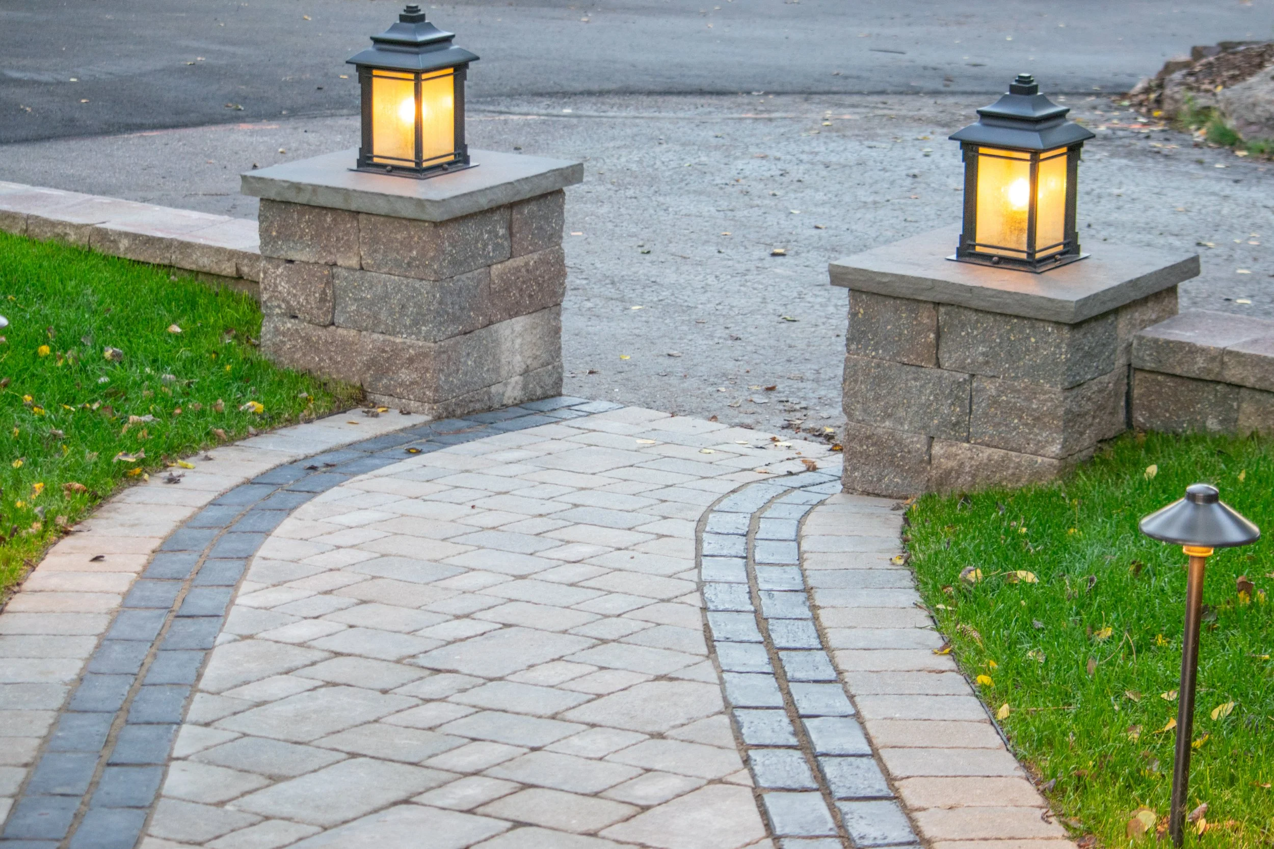 A paver walkway in Evergreen, CO with landscape lighting
