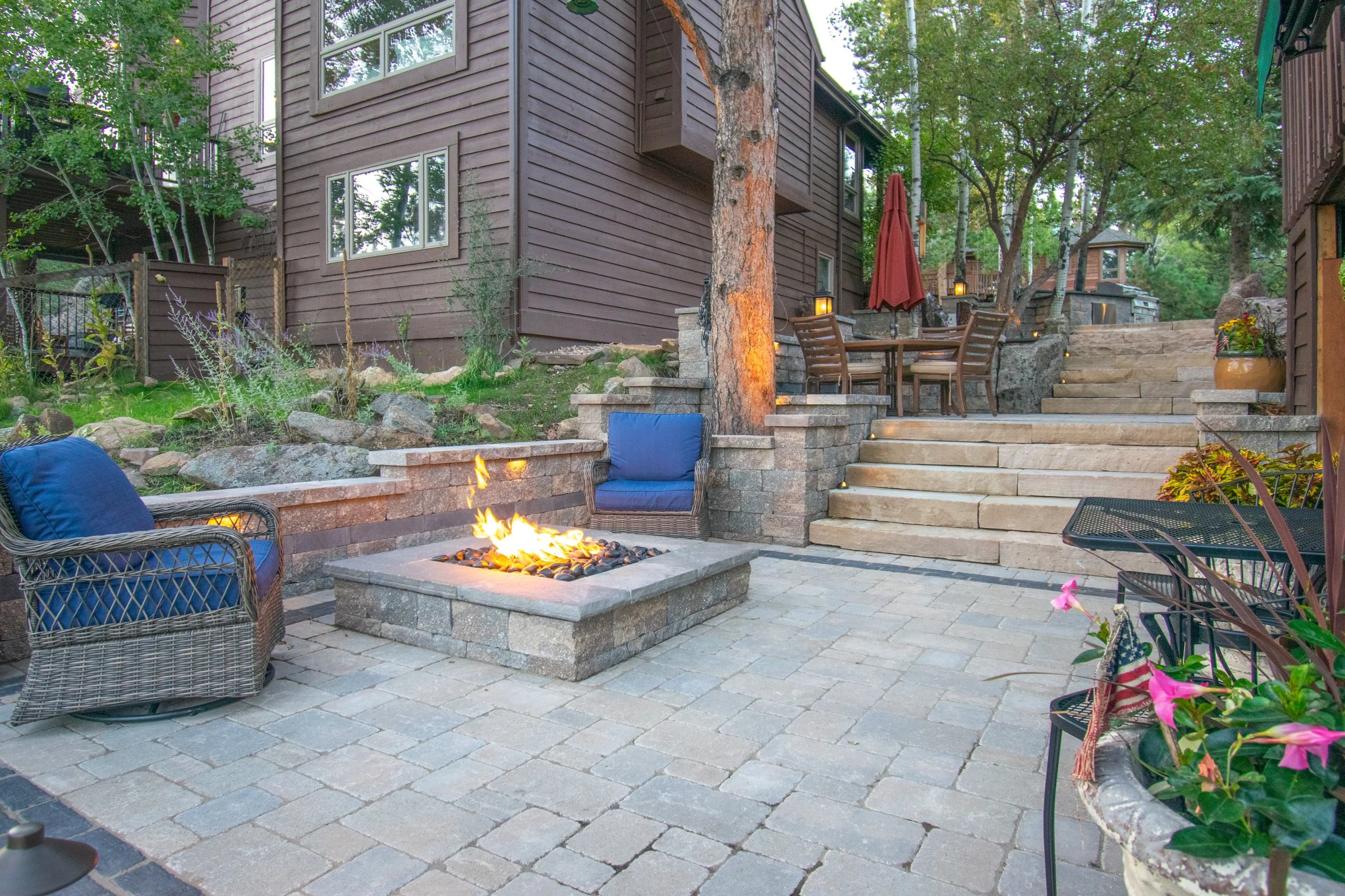 Outdoor patio with sitting area, fire pit and stone steps