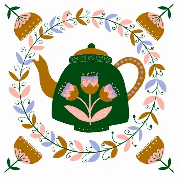 Image of a green teapot in a wreath of flowers.