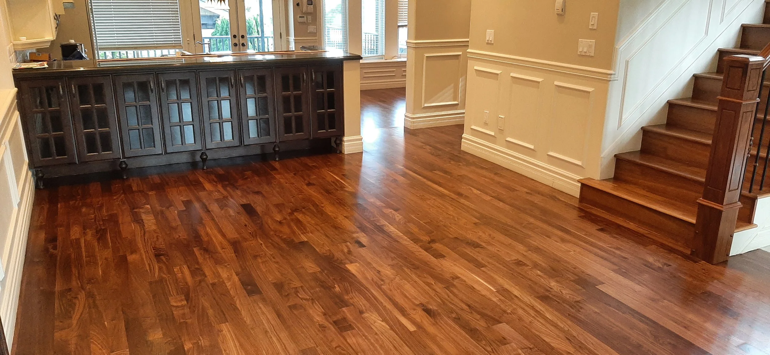 What are the benefits of refinishing my hardwood floors versus