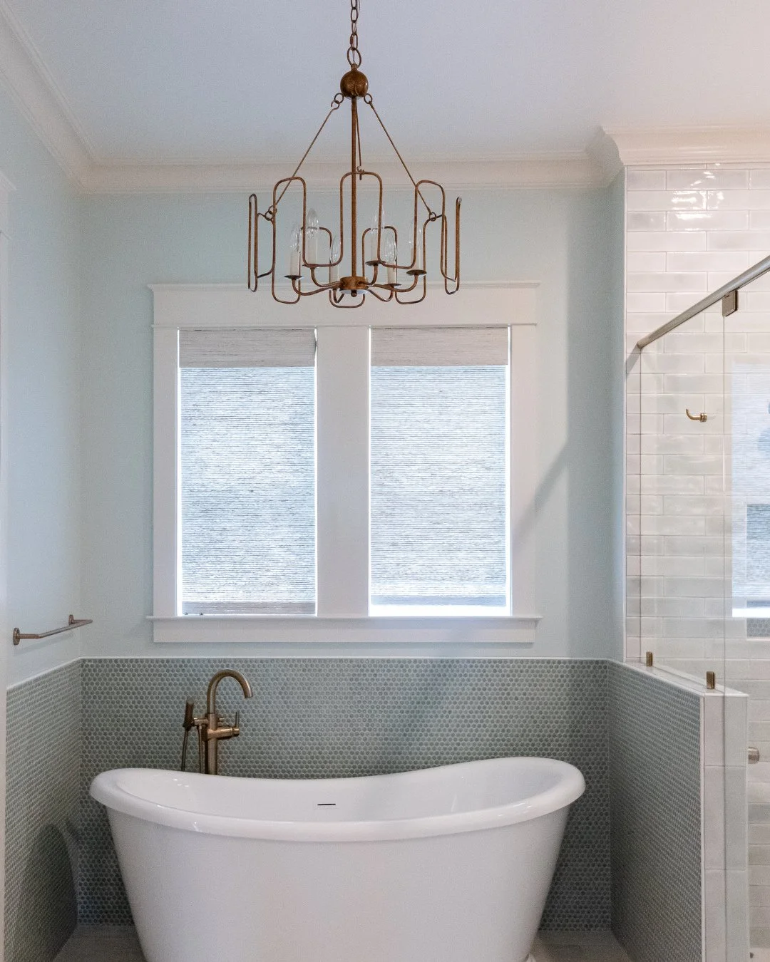 A little weekend calm. 🛁⁠
⁠
Soft blues, penny tile, and warm brass create the perfect place to unwind.⁠
⁠
#bathroominspo #soakingtub #weekendcalm #pennytile