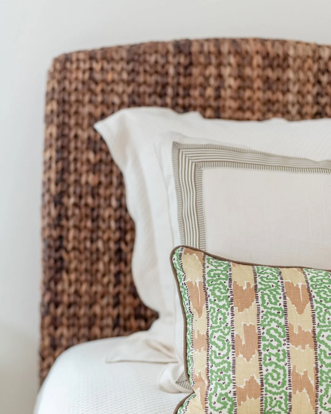 Neutral browns and greens set the tone in this guest room. Ready for whatever company&rsquo;s coming through, these twin beds and furnishings were thoughtfully chosen to be easily rearranged into a king in no time. A little design detail that makes h