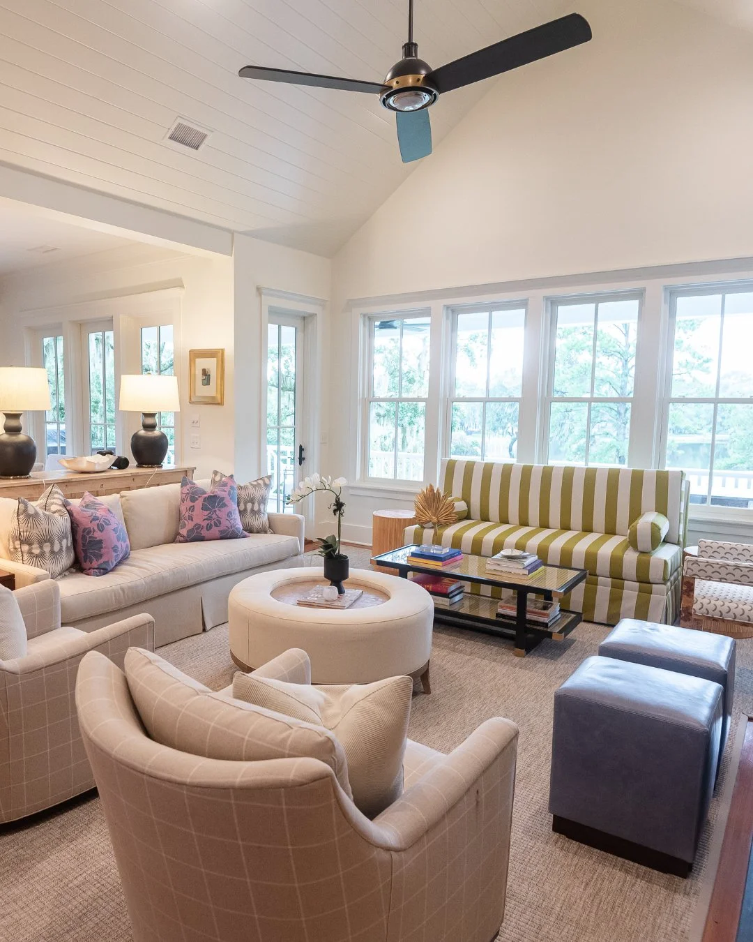 This space was designed with one thing in mind: bringing everyone together. Lots of seating for the whole family, anchored by a custom green striped sofa we absolutely love, so of course we had to give it its own moment here.⁠
⁠
#livingroomdesign #li