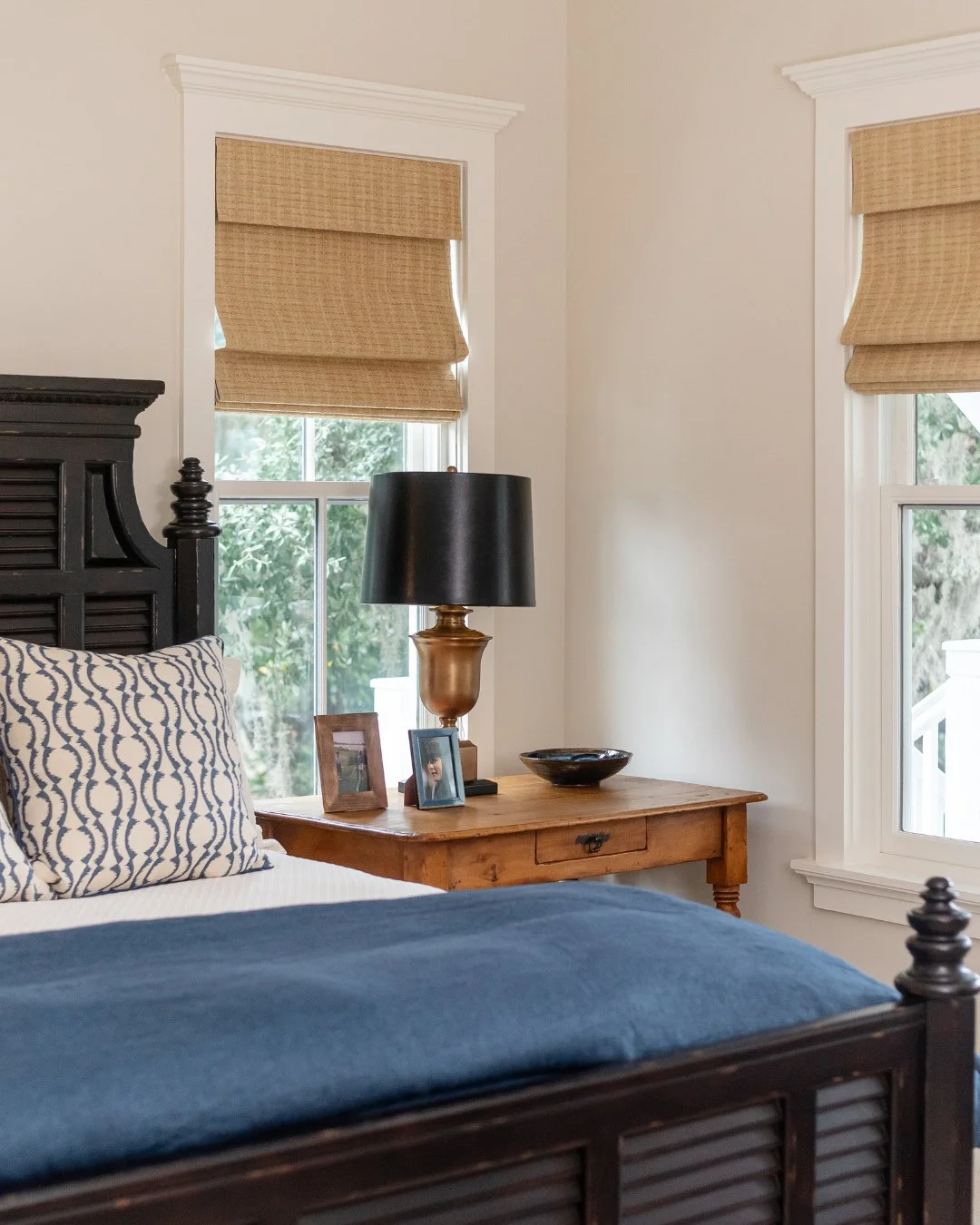 The key to using darker furniture is contrast. Soft whites, warm woods, and natural texture keep the room feeling layered and relaxed.⁠
⁠
#wynnepeaceinteriordesign #coastalliving #bedroomgoals #navyandblack