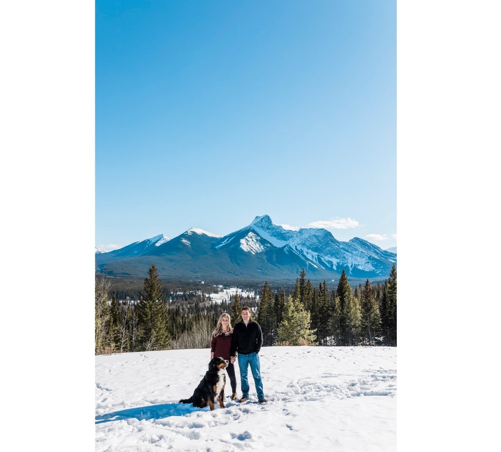 07_sunlight_landscape_Kananaskis_Canmore_Banff_trees_couple_engagement_close_simple_dog_cuddle_kiss_golden_hour_intimate_nature_mountains_fiancee_spring_winter_delicate_ice_bride_snow_soft_Calgary_Alberta_photographer_forest_groom_outdoor.jpg