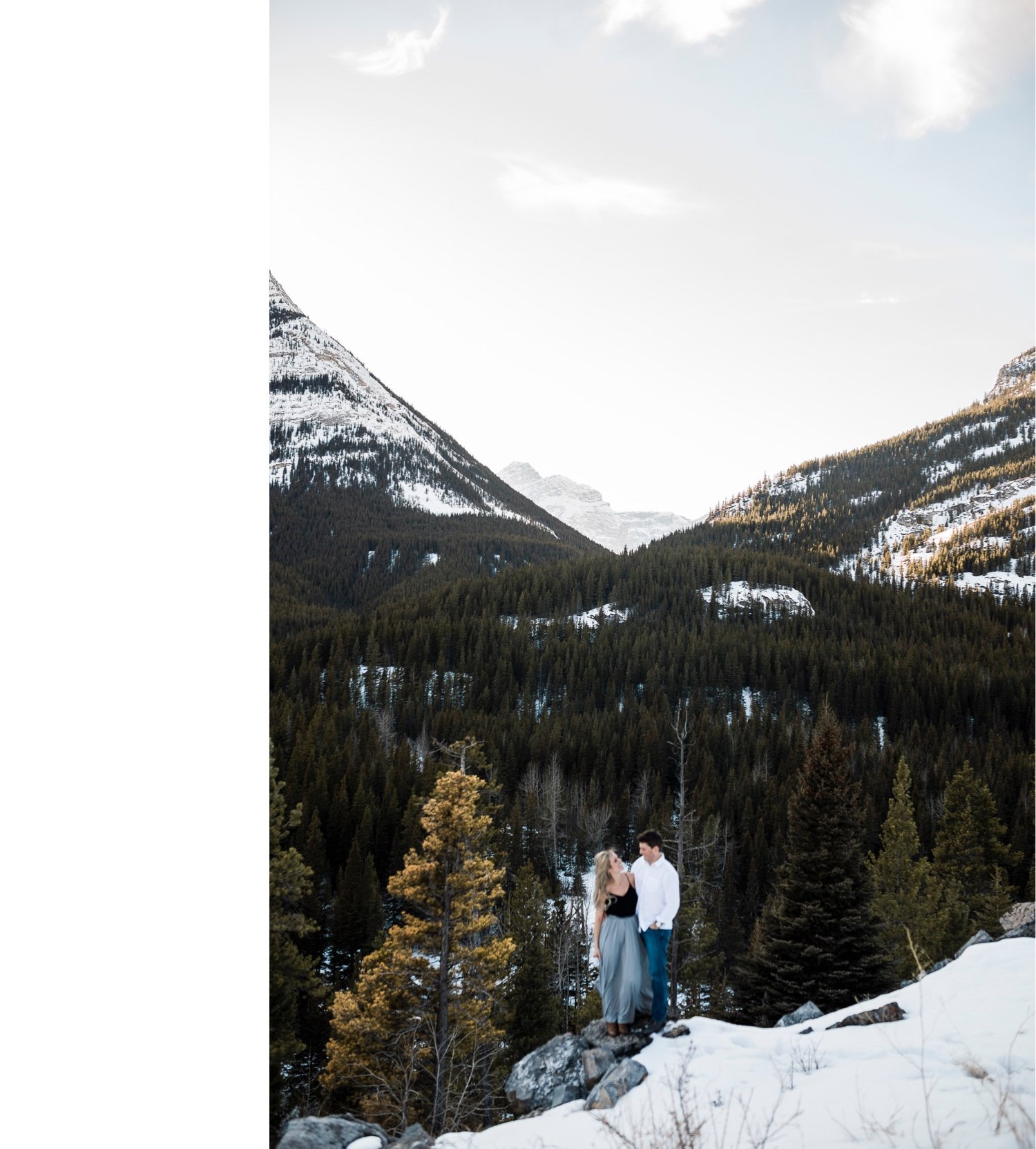 21_sunlight_landscape_Kananaskis_Canmore_Banff_trees_couple_engagement_close_simple_dog_cuddle_kiss_golden_hour_intimate_nature_mountains_fiancee_spring_winter_delicate_ice_bride_snow_soft_Calgary_Alberta_photographer_forest_groom_outdoor.jpg