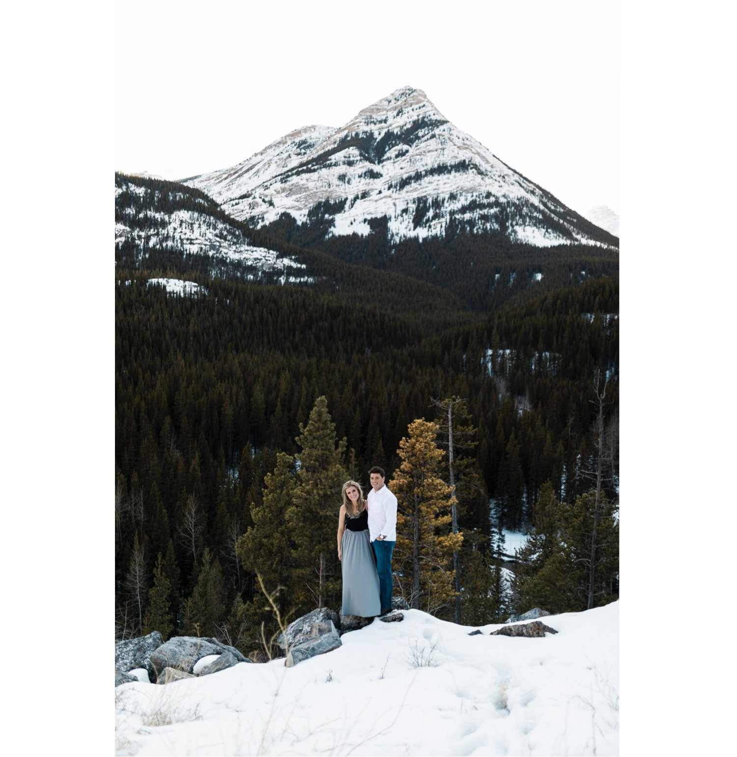 26_sunlight_landscape_Kananaskis_Canmore_Banff_trees_couple_engagement_close_simple_dog_cuddle_kiss_golden_hour_intimate_nature_mountains_fiancee_spring_winter_delicate_ice_bride_snow_soft_Calgary_Alberta_photographer_forest_groom_outdoor.jpg