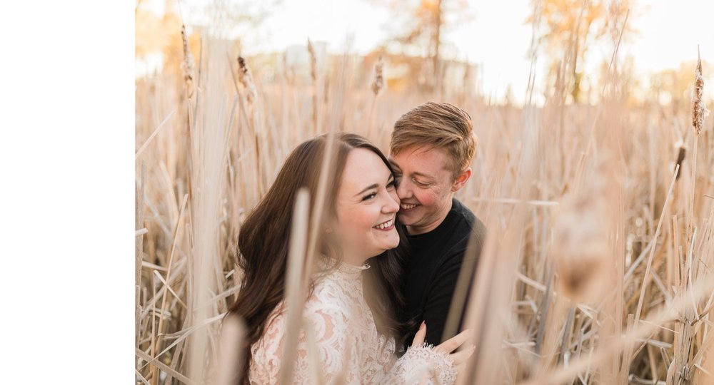 21_2018 29440_sunlight_landscape_trees_couple_engagement_close_Calgary_cuddle_kiss_simple_golden_hour_intimate_nature_autumn_soft_fiancee_delicate_bride_Alberta_photographer_forest_groom_outdoor.jpg
