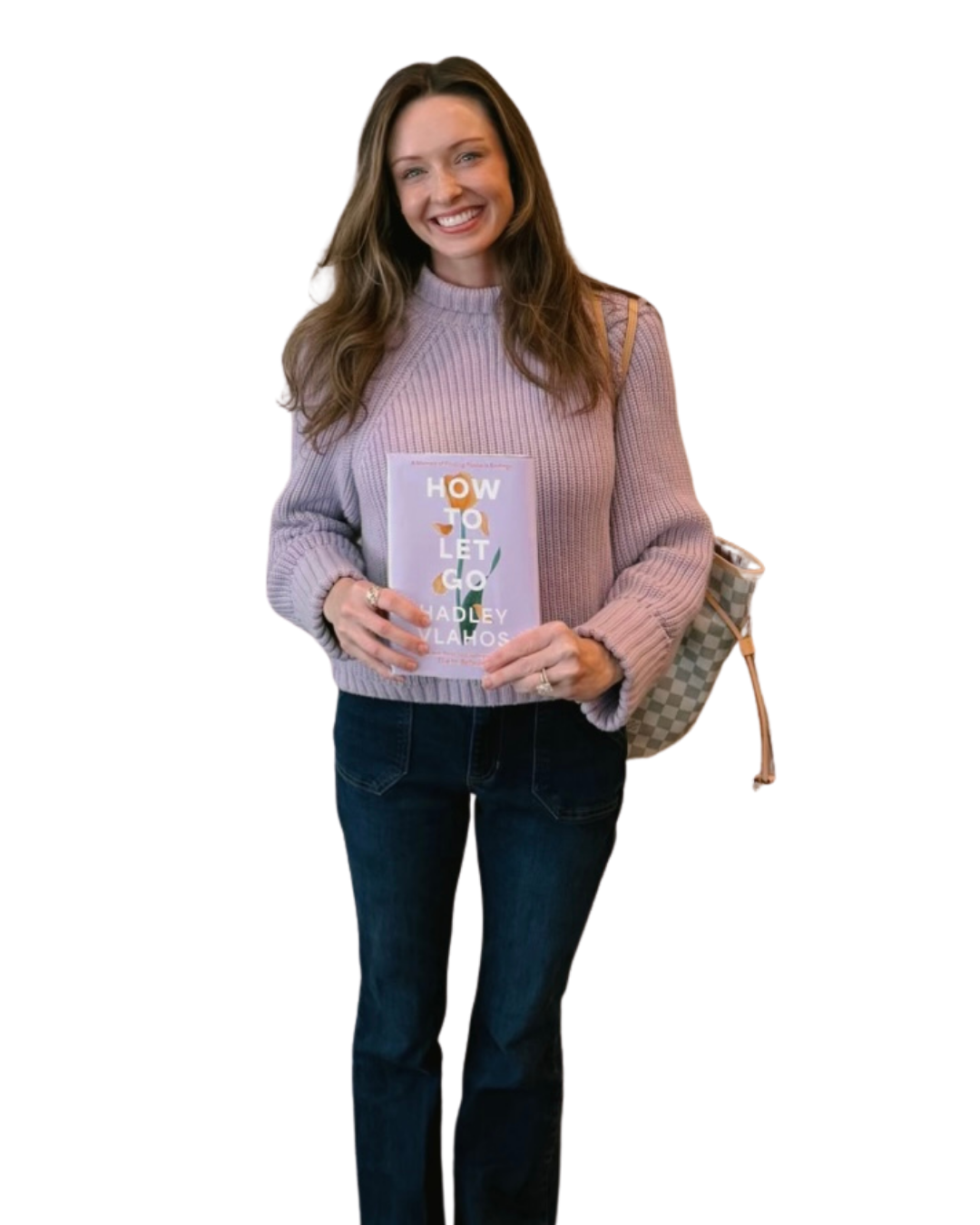 Woman wearing a pink sweater holding a book titled 'How to Let Go' by Hayley Llamas, carrying a checkered bag.