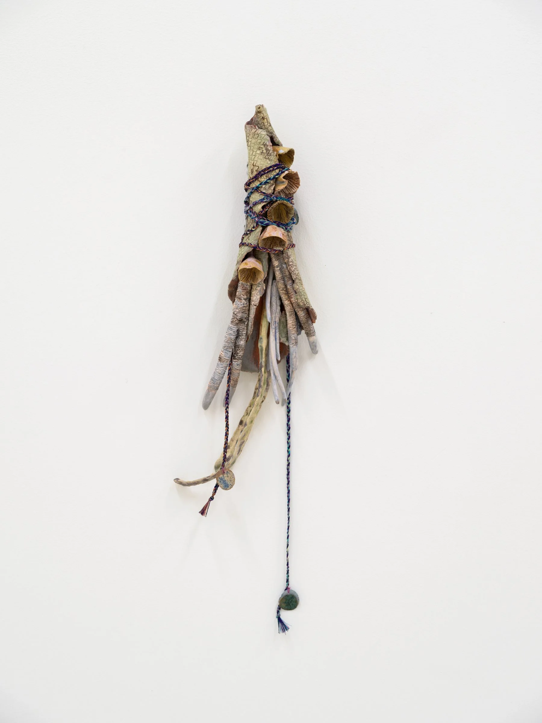 Untitled 1, 2023. Paper maché, wire, glazed ceramic, yarn, transparent paper, paper, graphite, charcoal, watercolor, muslin, hand dyed fabric, hand made cords, 17 x 4 x 1 3/4 in (43.18 x 10.16 x 4.445 cm).