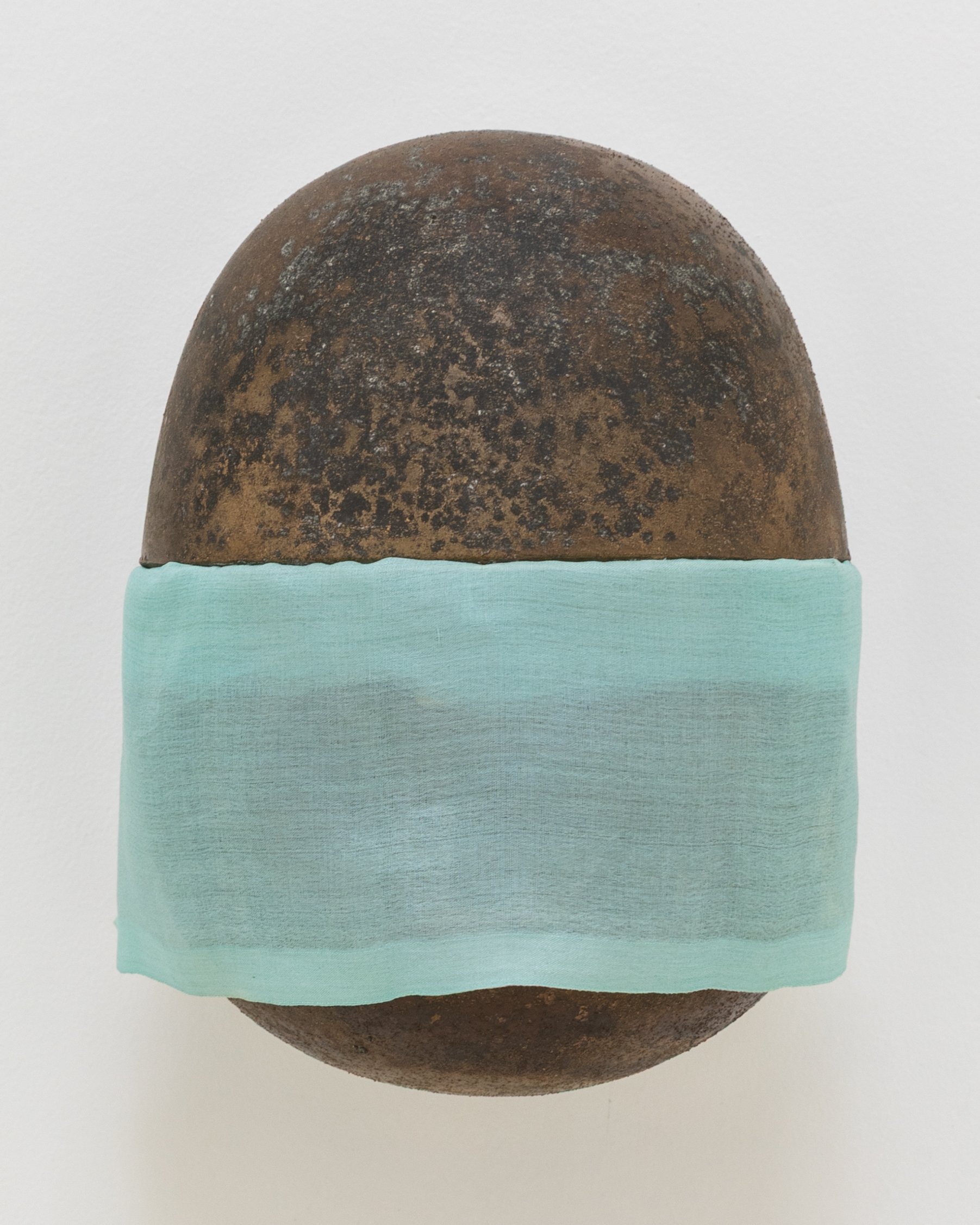 Untitled, 2024. Cast bronze and hand-dyed silk, 8 x 5 1/2 x 6 in (20.3 x 14 x 15.2 cm)