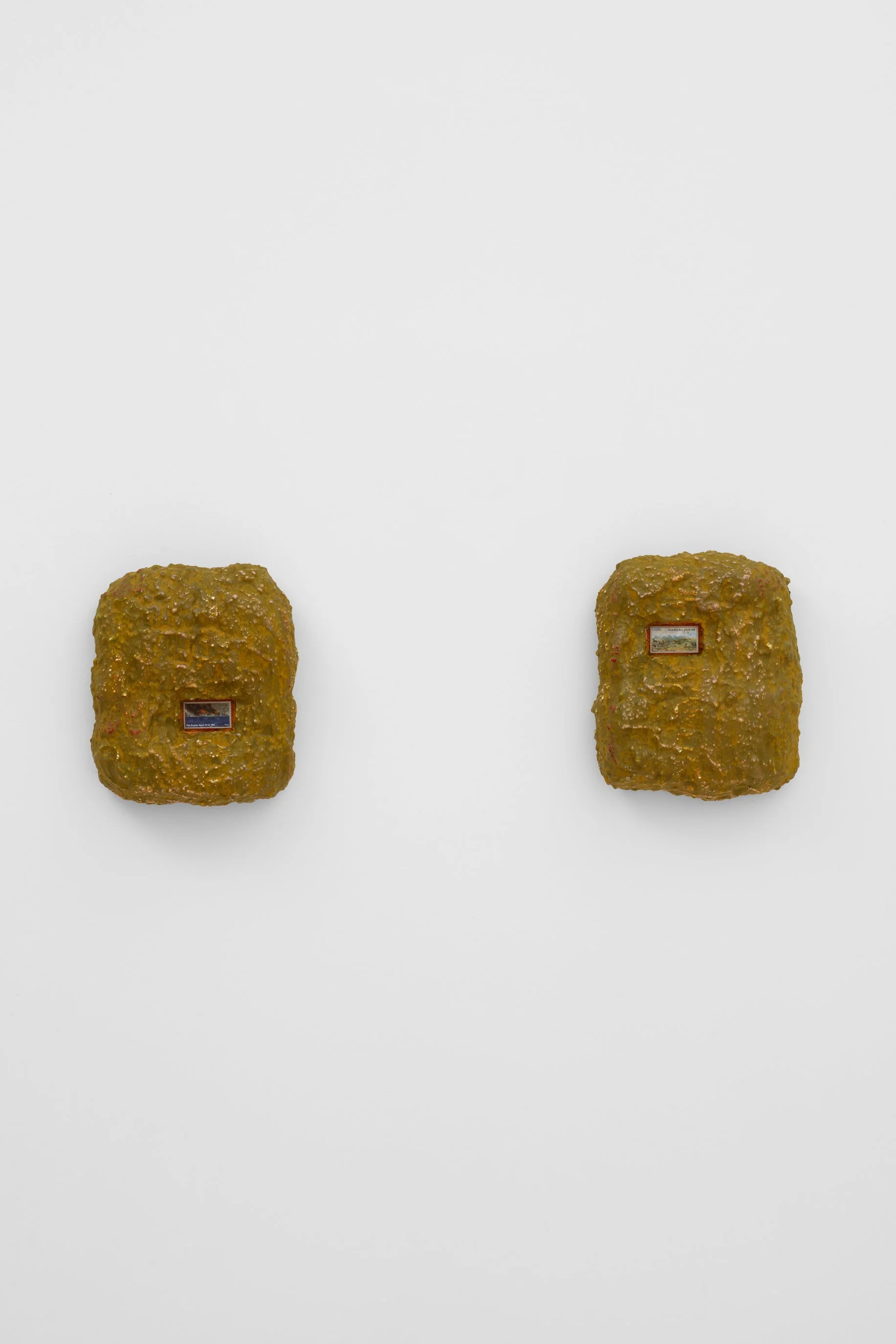 Mark A. Rodriguez, Forever .0039, Forever .0040, 2026. Postage stamp, acrylic, sculptamold, plywood, (L)  10 3/4 x 9 1/4 x 3 3/4 in (27.3 x 23.5 x 9.5 cm) (R) 11 1/8 x 9 1/4 x 4 in (28.3 x 23.5 x 10.2 cm)
