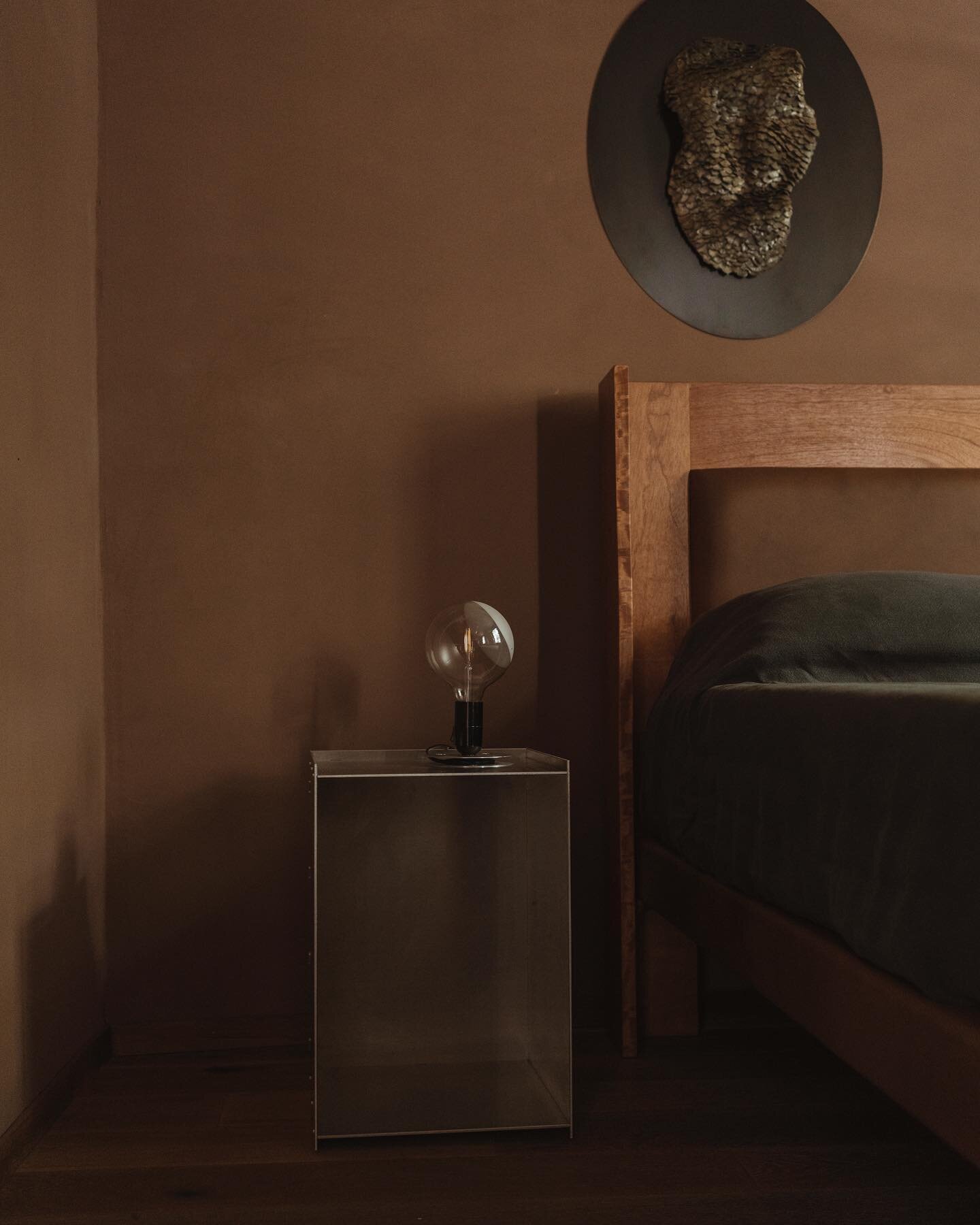 The primary bedroom in my Casa Verde project. The pinky-brown plaster wall treatment compliments the low natural light in this part of the house and makes the bedroom extra relaxing. The bed frame, made of red cedar with brown leather details, is a c