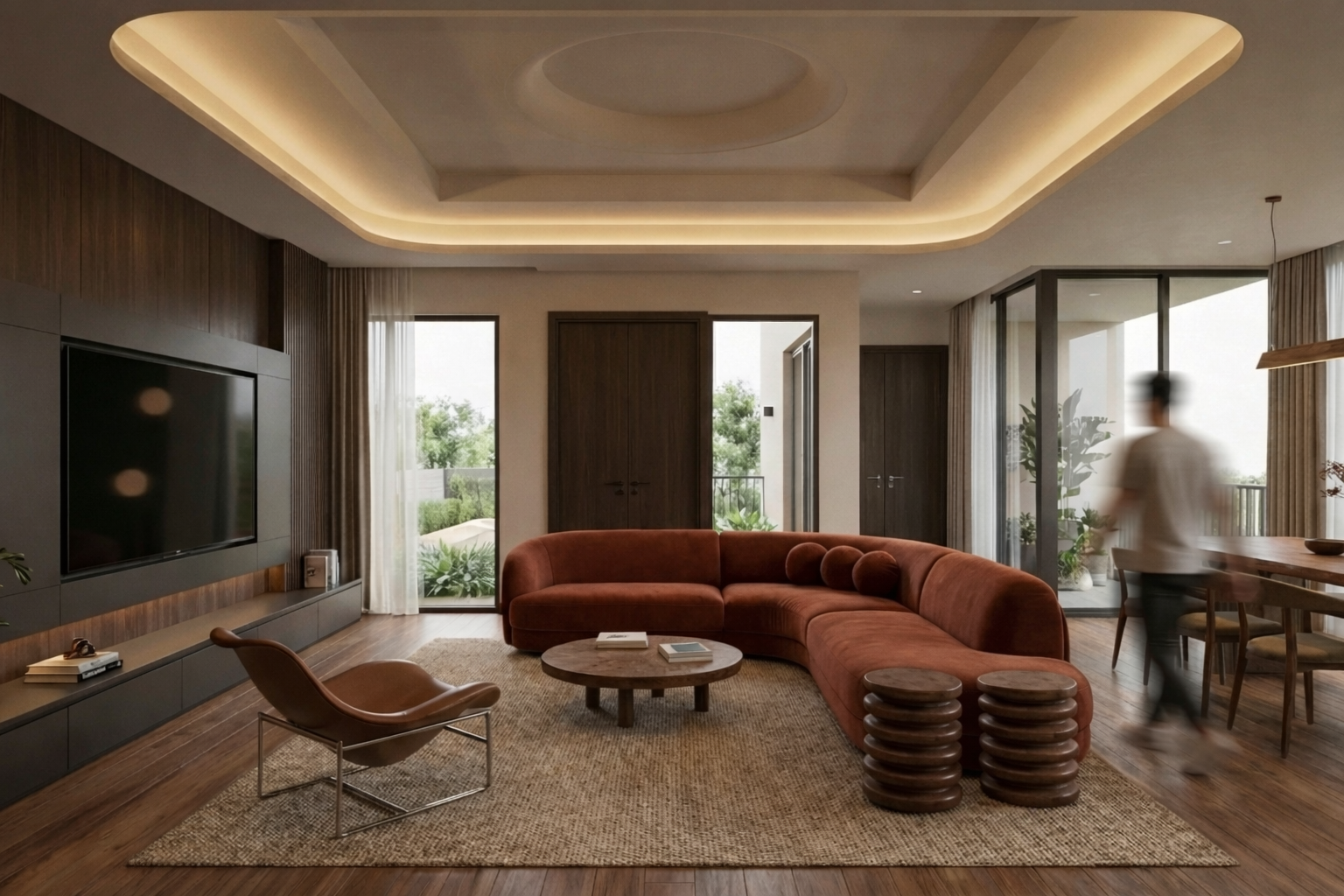 Modern living room with curved rust-colored sofa, wooden coffee table, leather lounge chair, television, and large windows with curtains