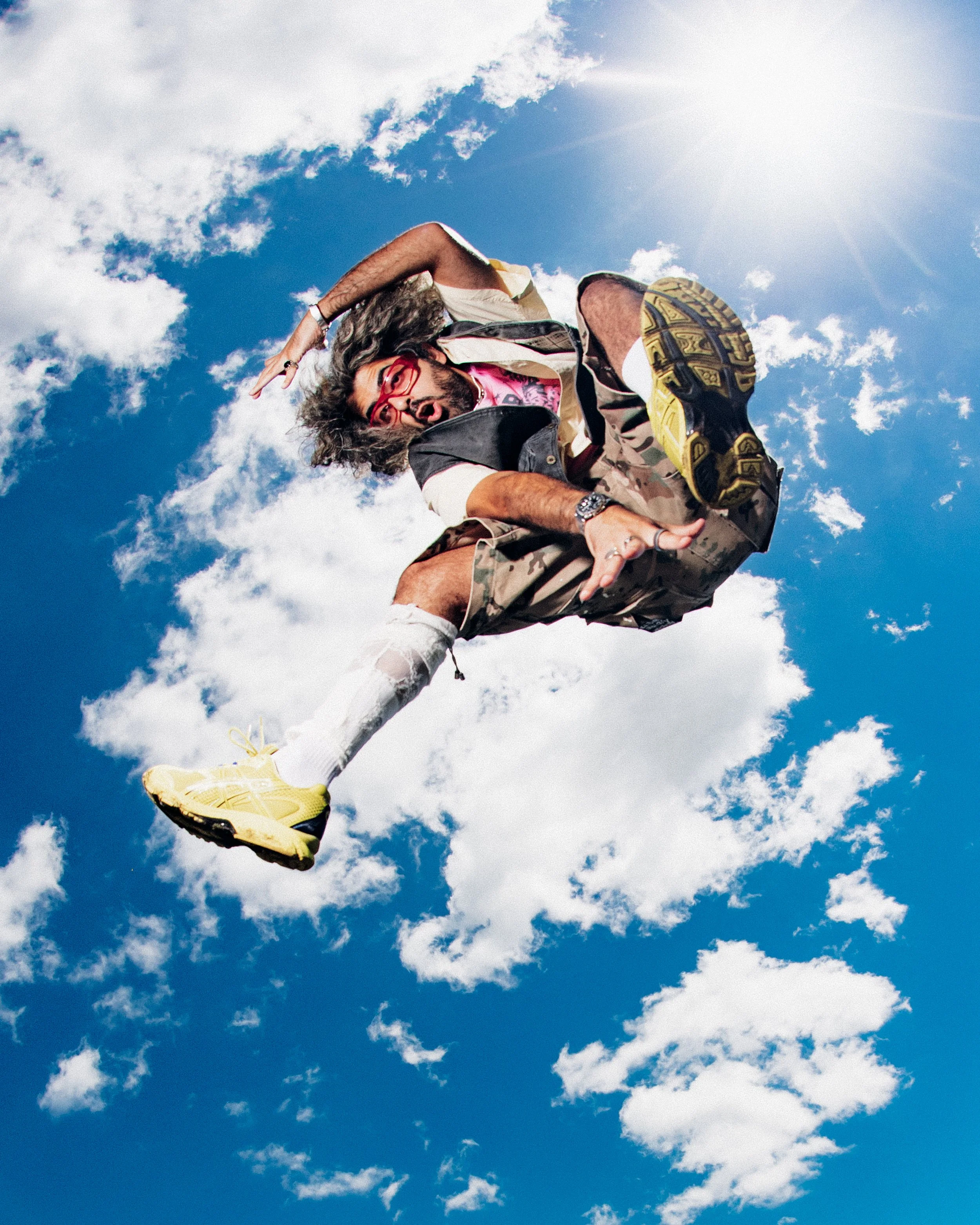   Glasses: Flatlist, Baby Tee: Nineteen99, Jorts: Ksubi, Shoes: Asics, Rings: Stolen Girlfriends Club  