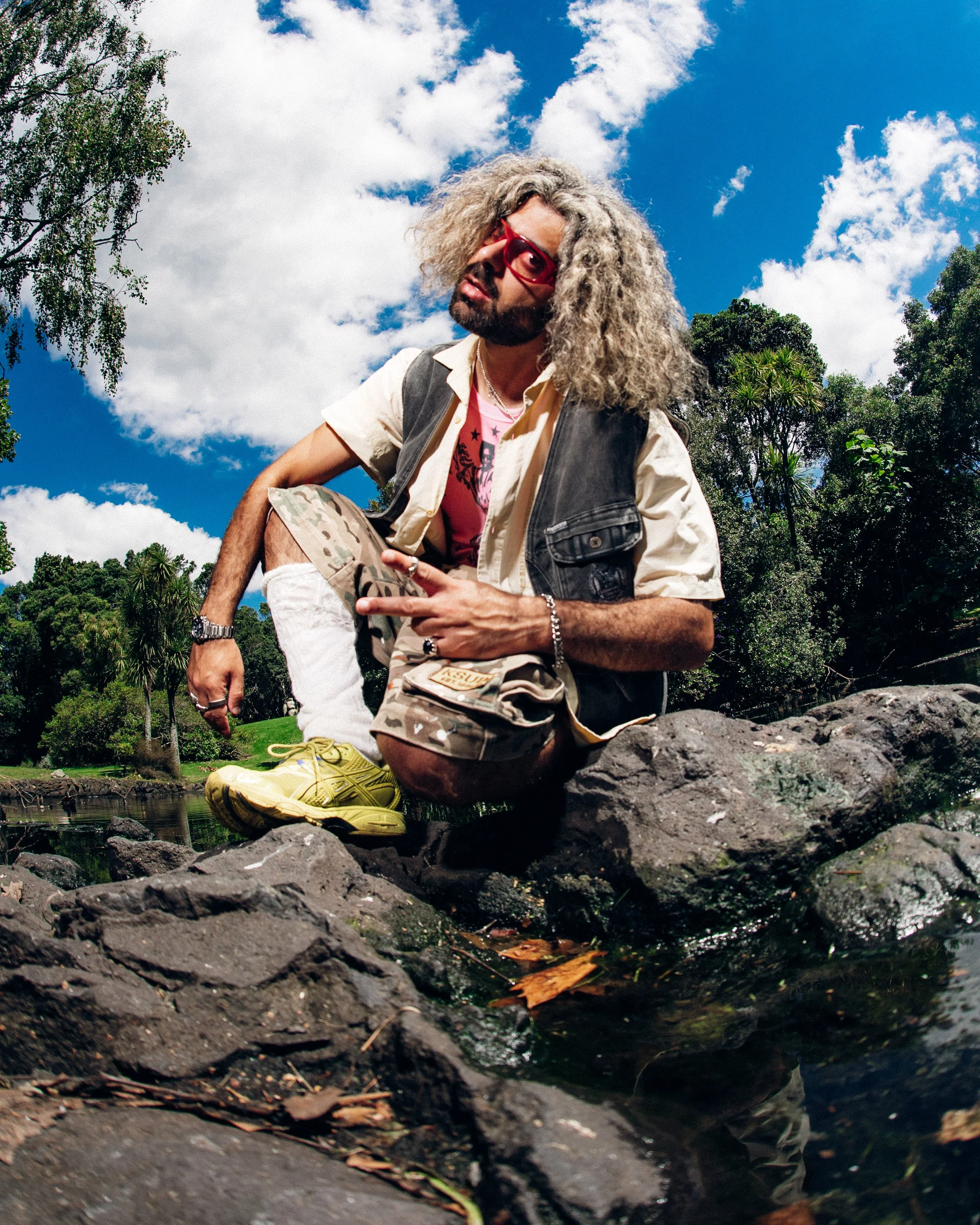   Glasses: Flatlist, Baby Tee: Nineteen99, Jorts: Ksubi, Shoes: Asics, Rings: Stolen Girlfriends Club  