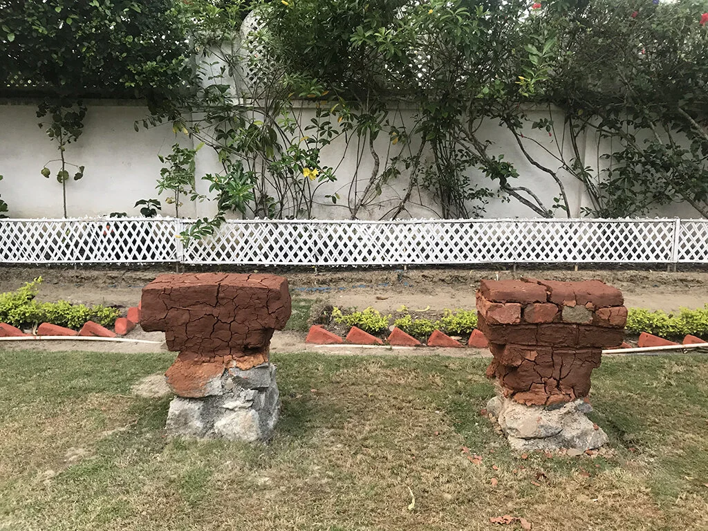 guwahati_bench_stone_mud_vernacular.jpg