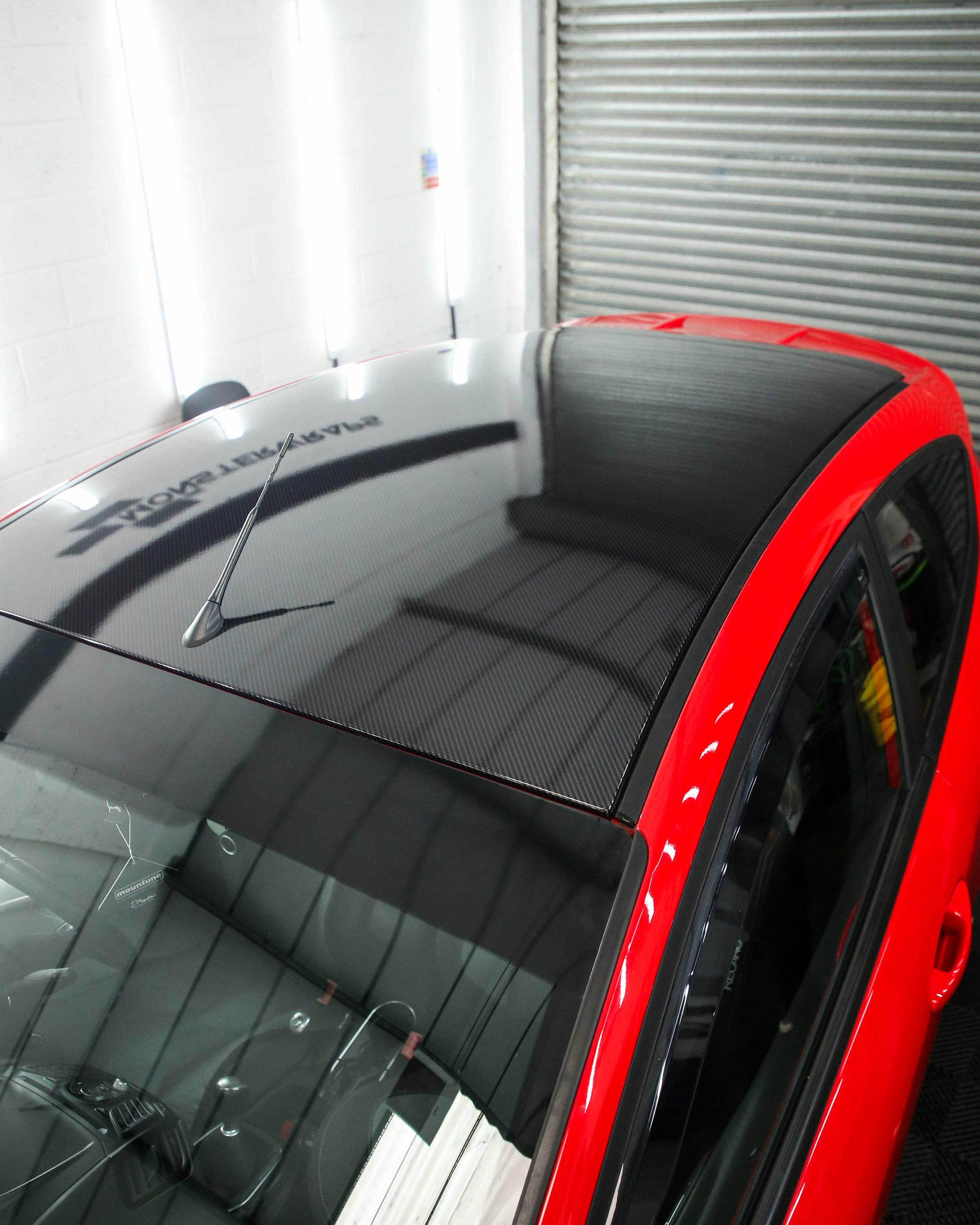 ford fiesta mk7 st roof wrapped in 3M high gloss carbon fibre twill weave wrapping vinyl