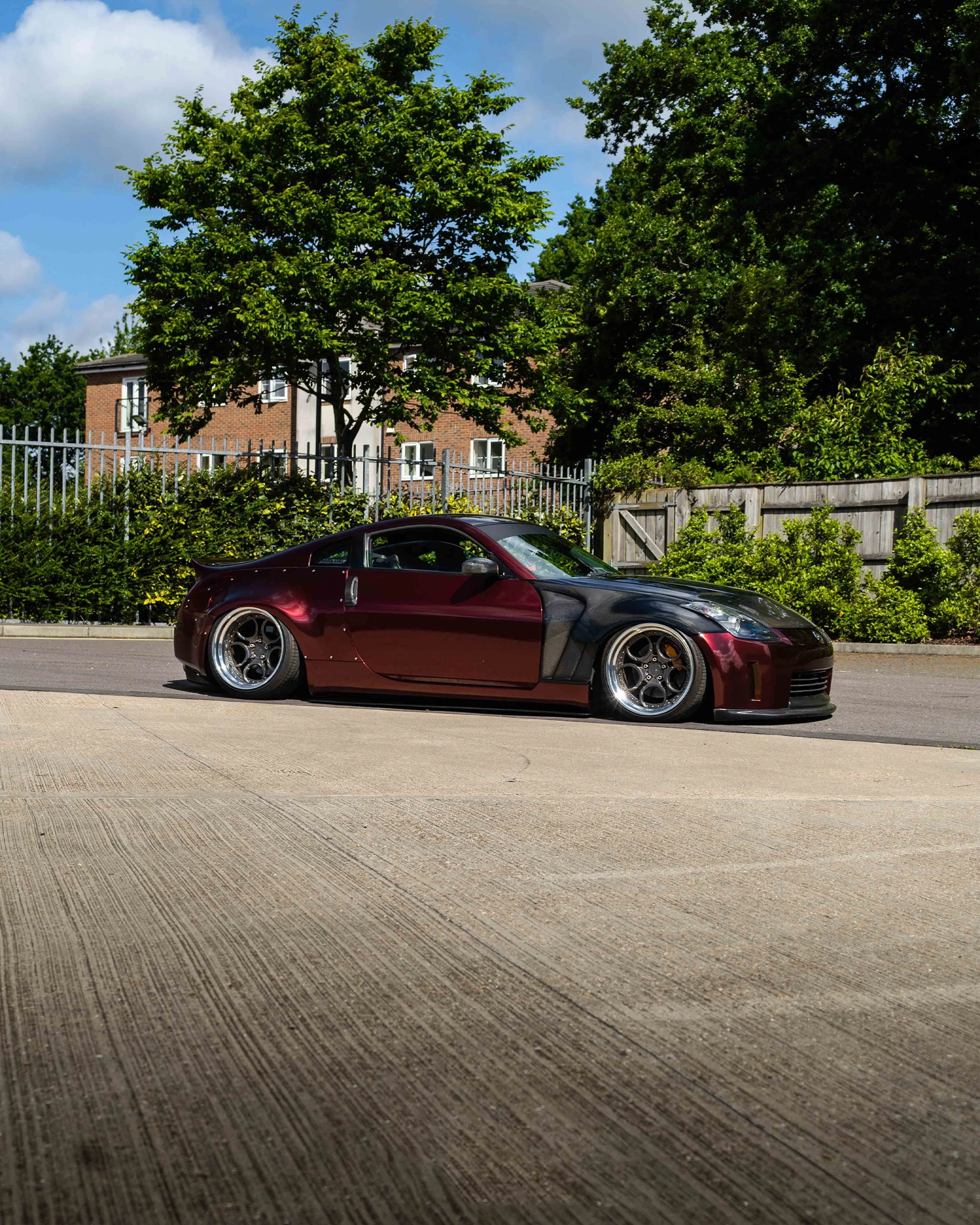 Nissan 350Z showcar full colour change wrap including door shuts and returns in Gloss KPMF Red Black Iridescent