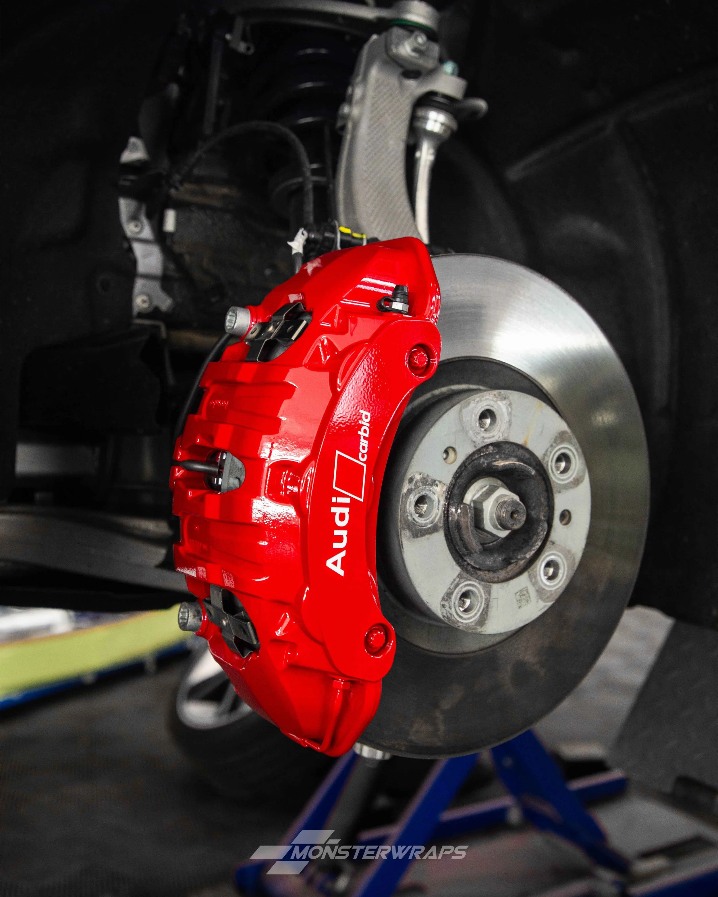 Audi E-Tron GT brake calipers painted in Gloss Performance Red