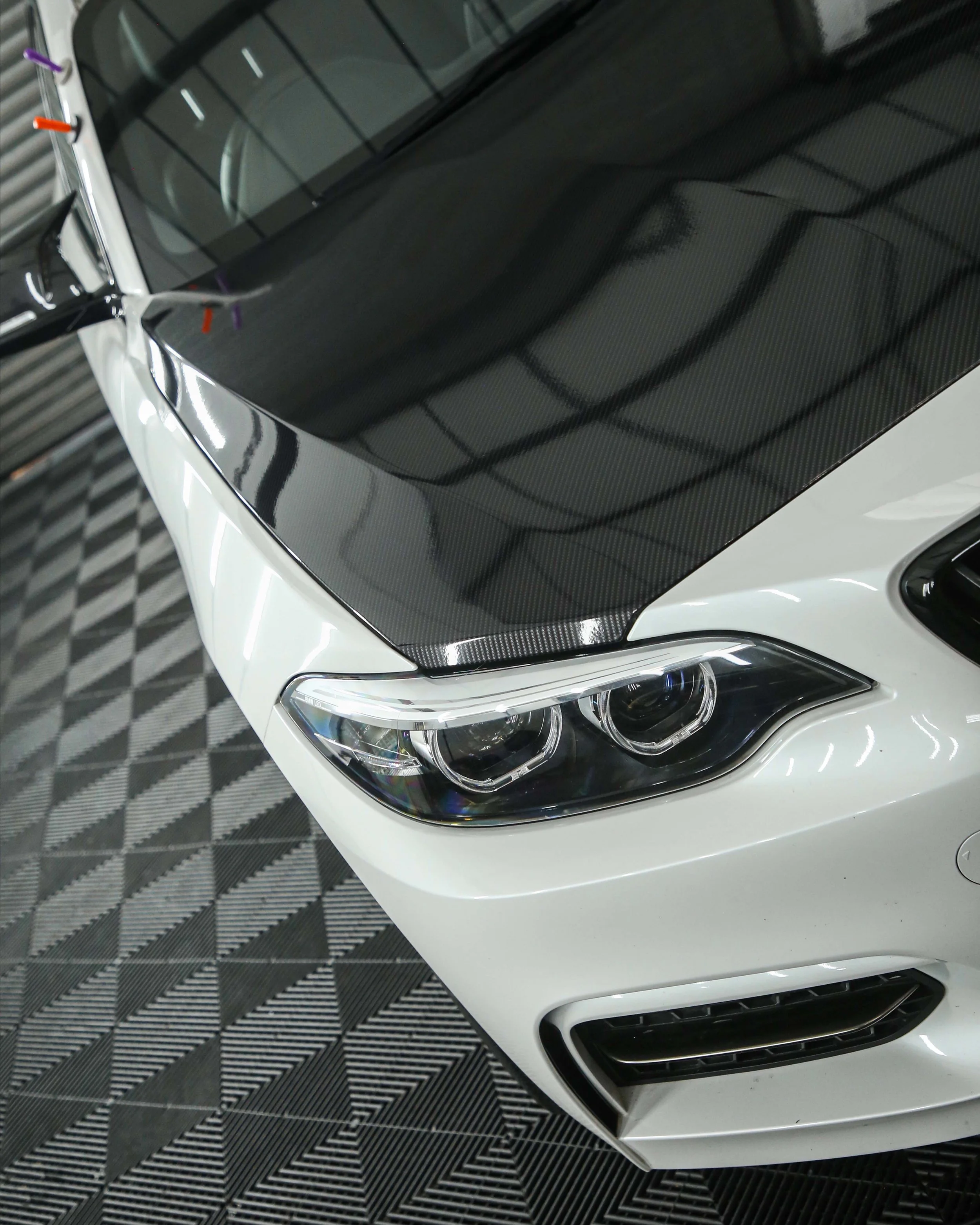 BMW M240I 2 series bonnet wrapped in 3M high gloss carbon fibre wrapping vinyl