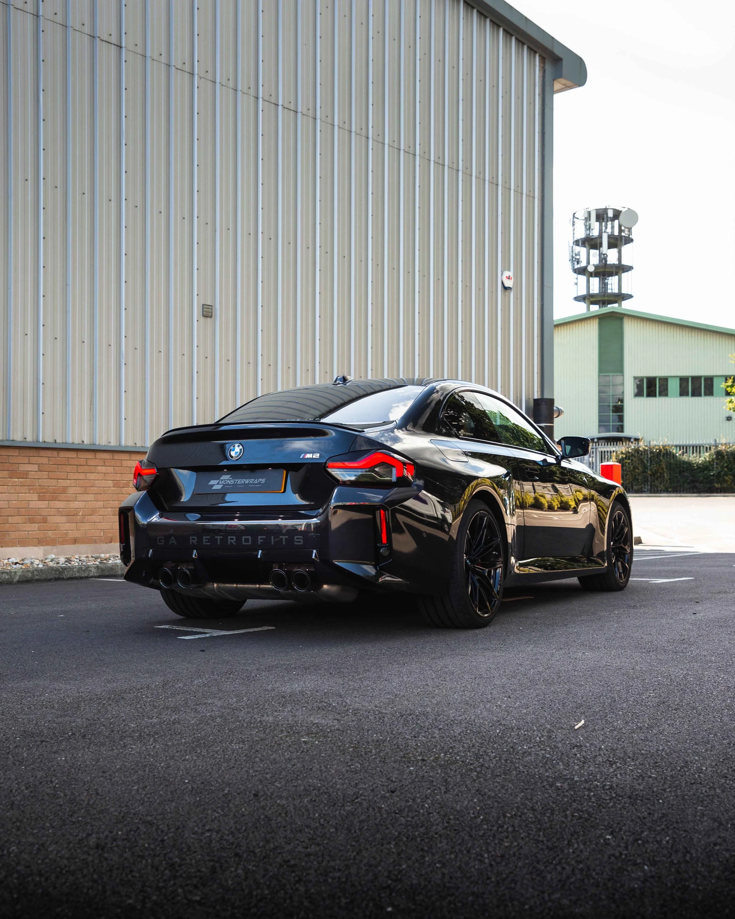 The brand-new BMW M2 G87 from GA Retrofits has been enhanced with subtle branded graphics! We applied Matte Black decals to the rear bumper and lower side skirts, creating a striking contrast against the Gloss Black paintwork. This delivers a sleek,