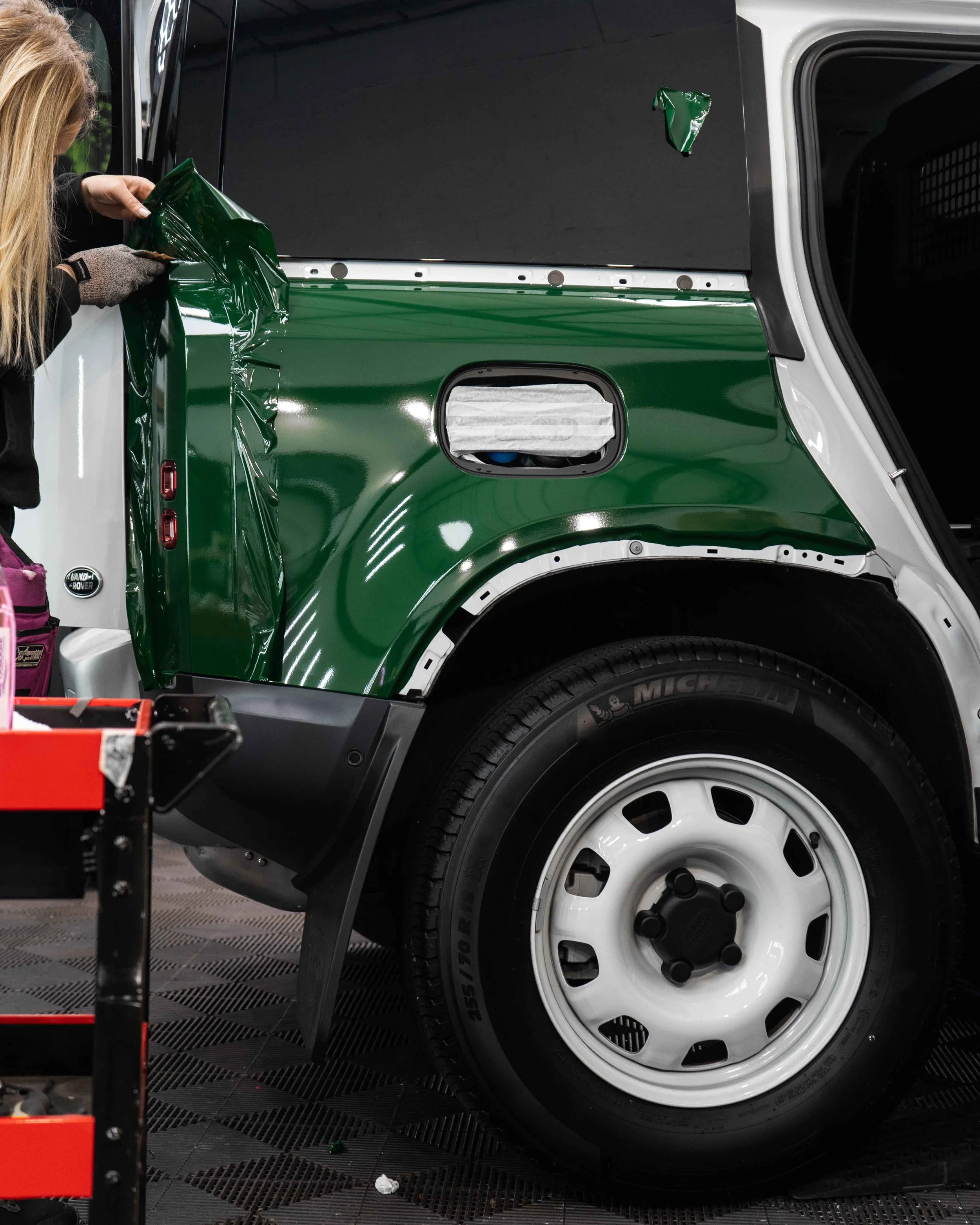 Land Rover Defender 90 full colour change vinyl wrap in Gloss Dark Green