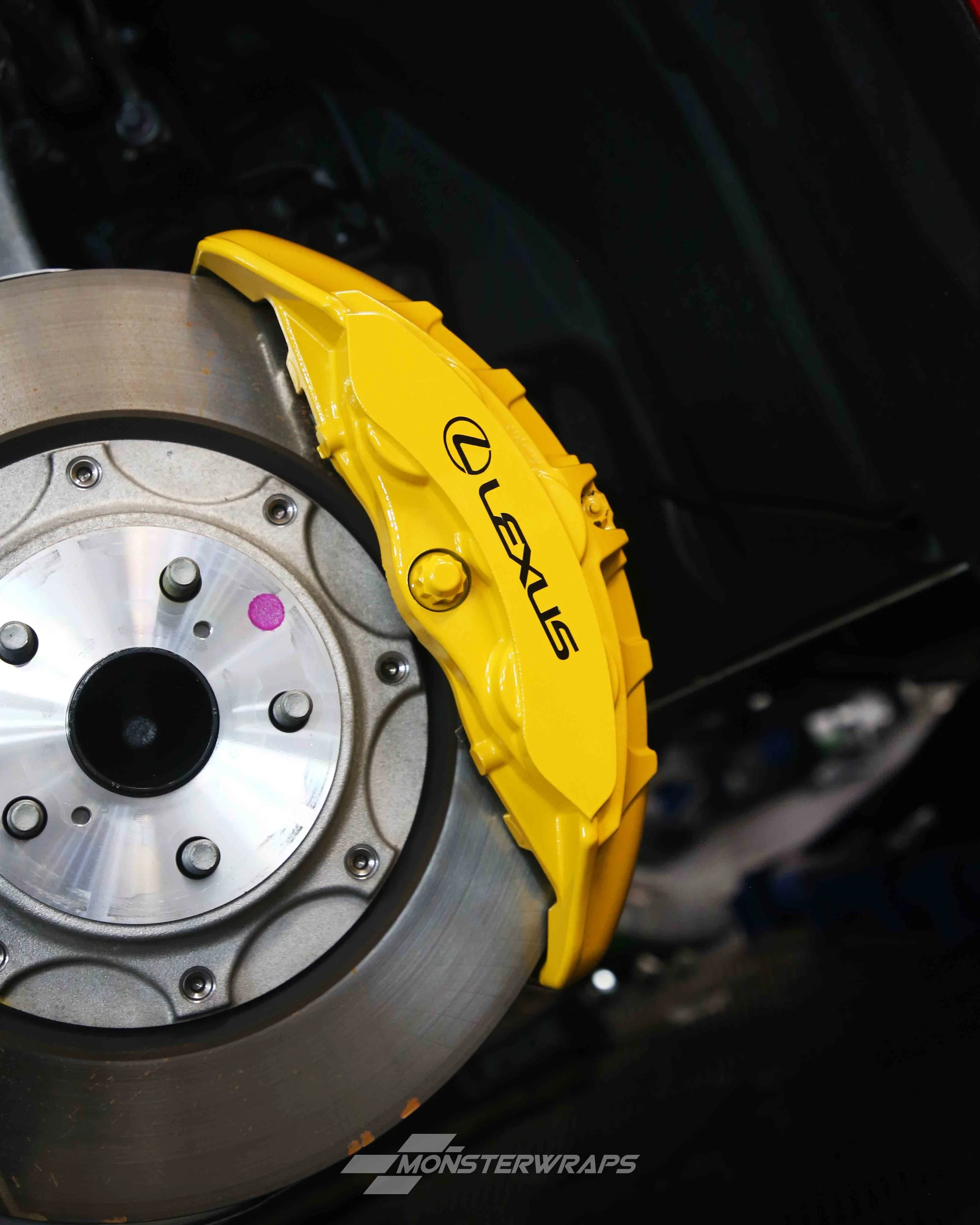 lexus LC500 brake calipers painted in gloss yellow