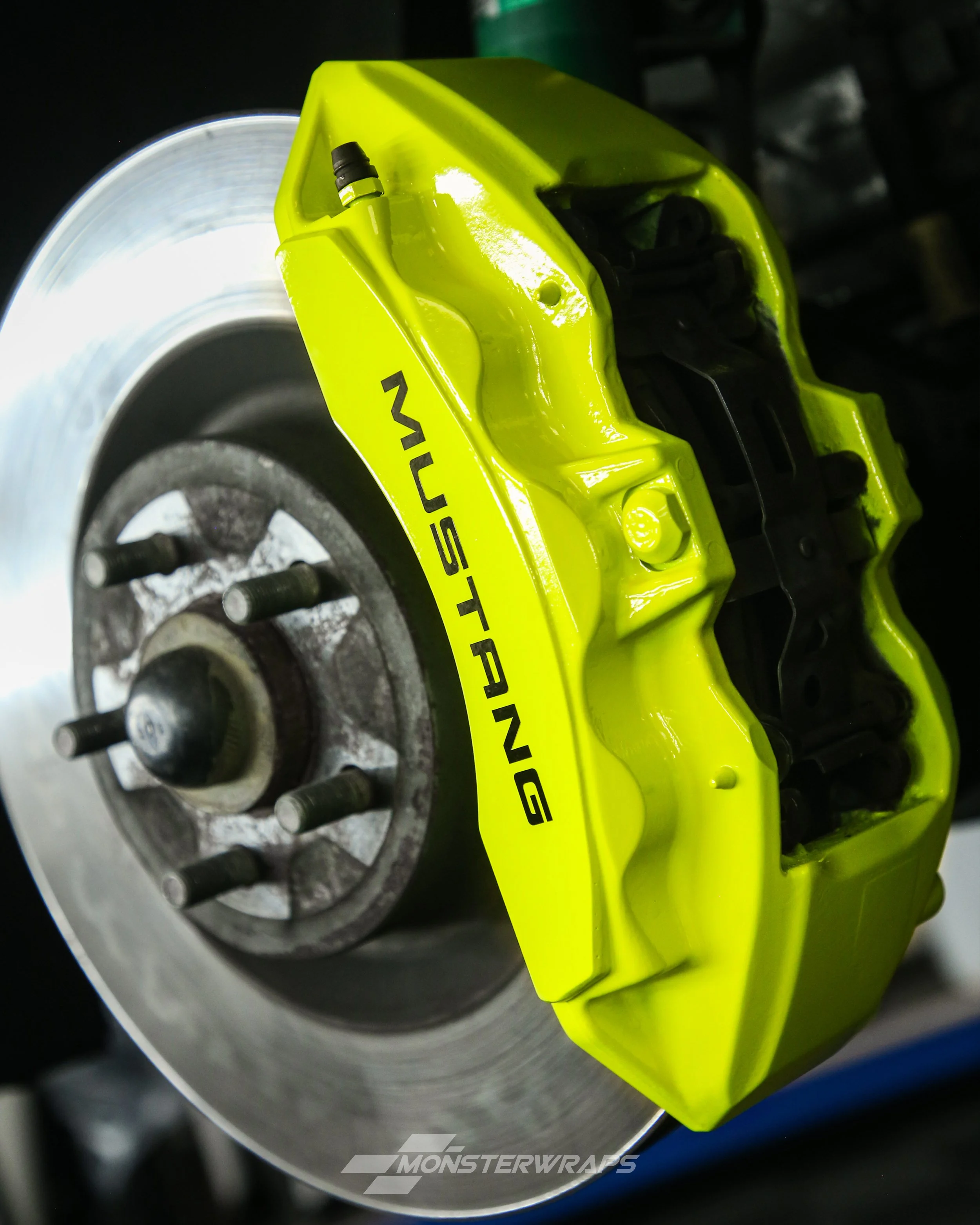 ford mustang brake calipers painted in gloss bright fluorescent yellow