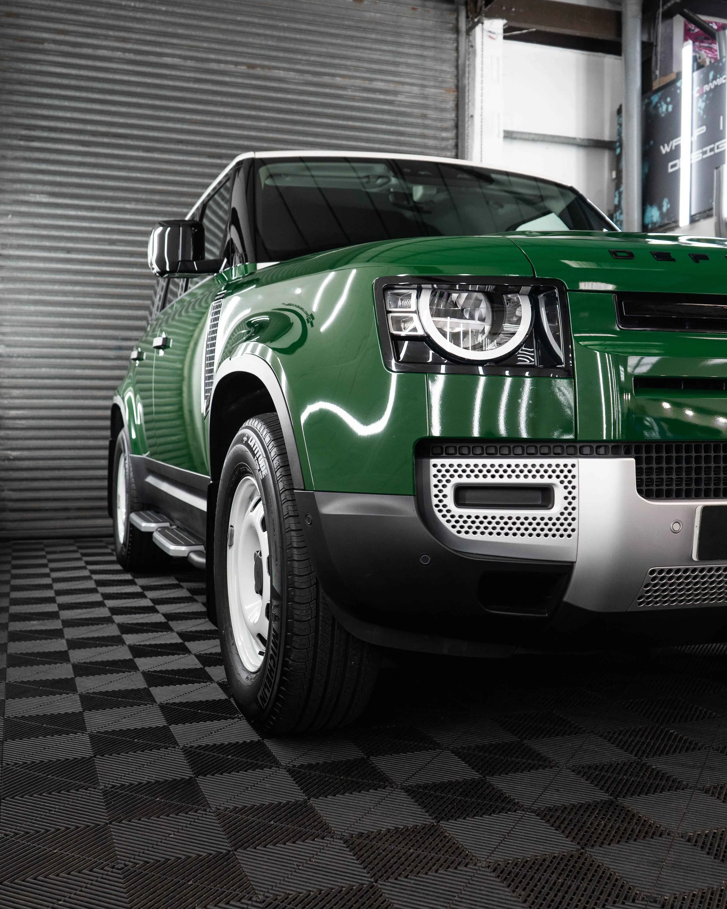 Land Rover Defender 90 full colour change vinyl wrap in Gloss Dark Green