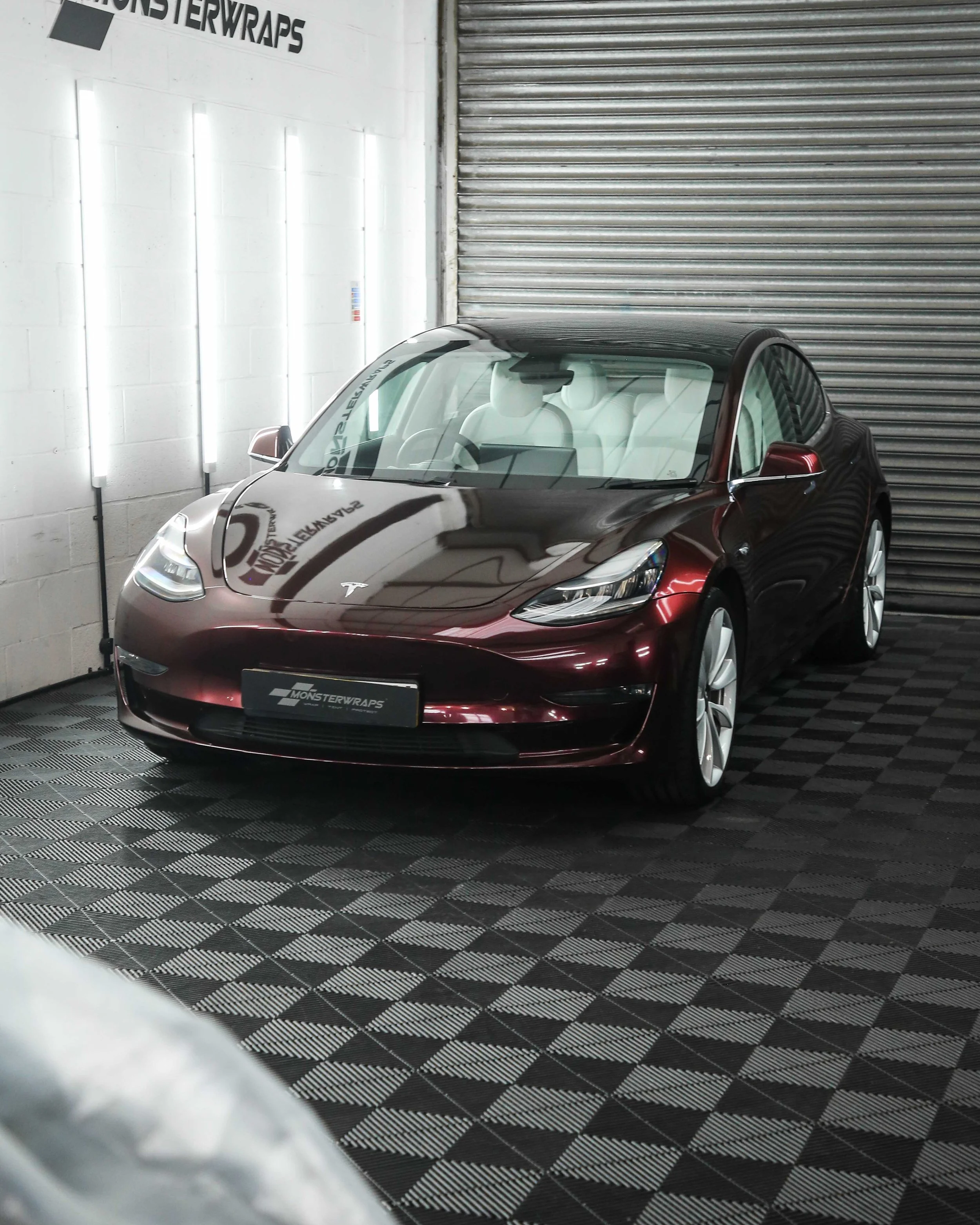 Tesla Model 3 full colour change vinyl wrap in gloss passion red metallic