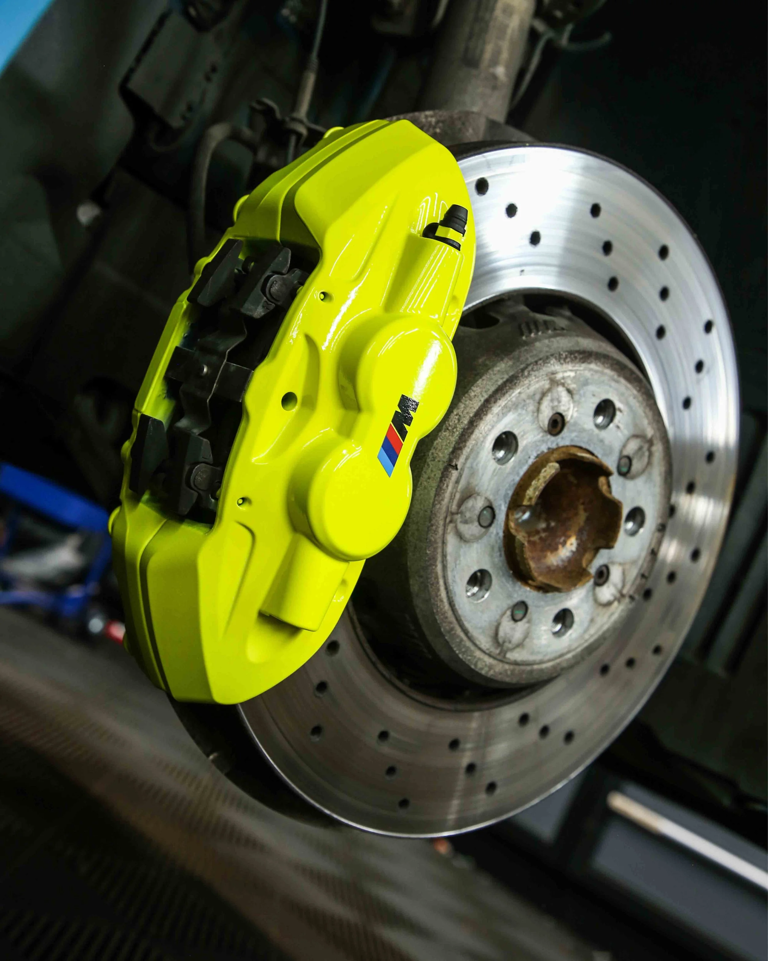 bmw m4 competition brake calipers painted in gloss fluorescent yellow