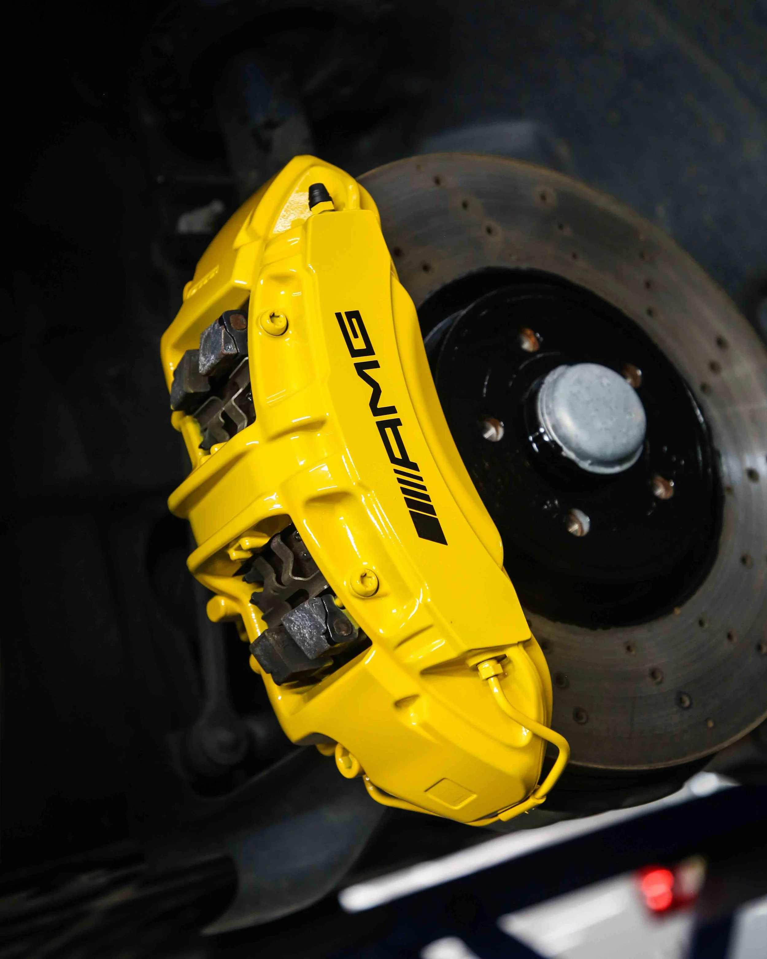 mercedes amg a45s brake calipers painted in gloss bright yellow