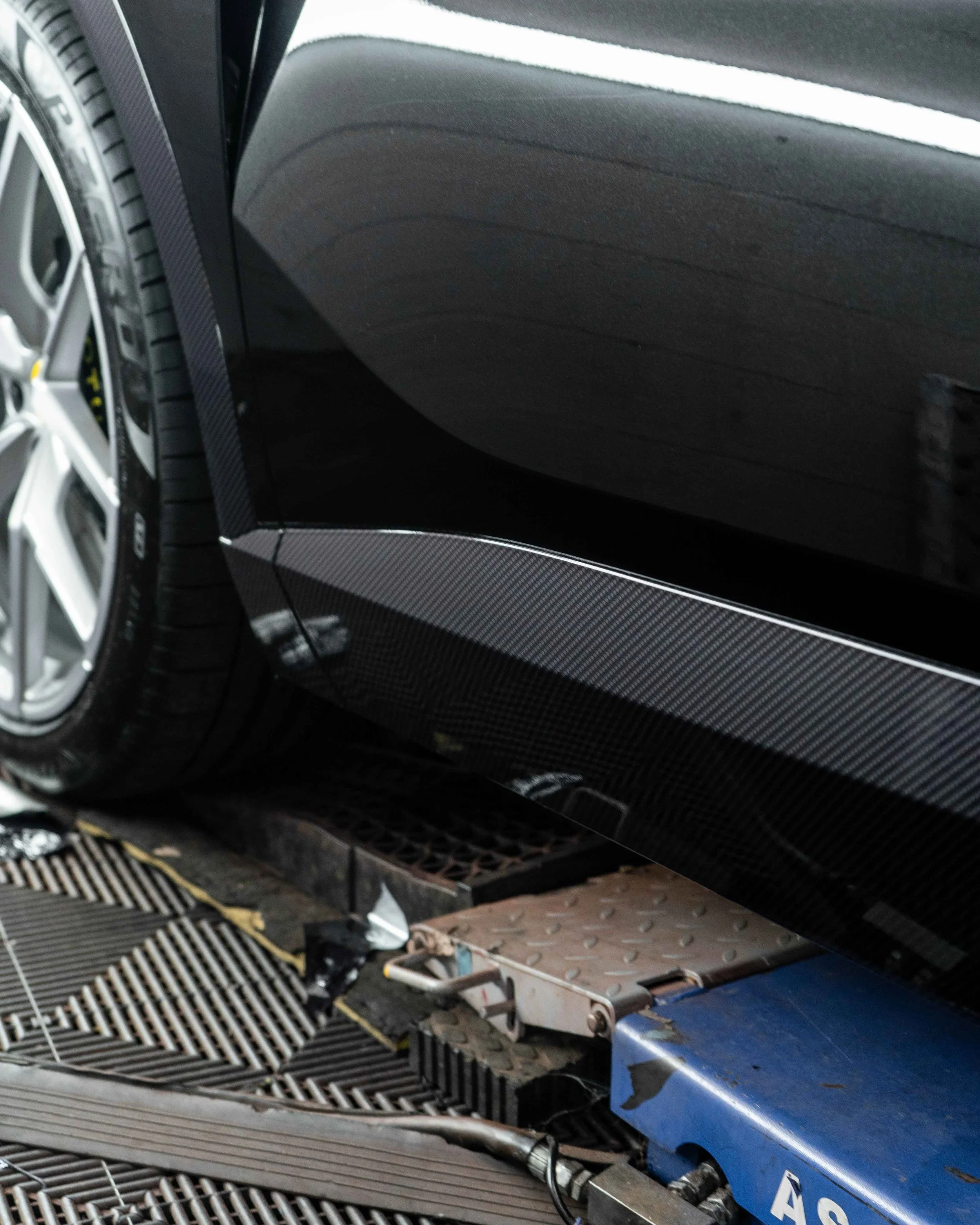 Lotus Eletre lower trims, spoiler, wing mirrors and bonnet wrapped in 3M Gloss Metallic Carbon Fibre wrapping film. Protected with a Ceramic coating.