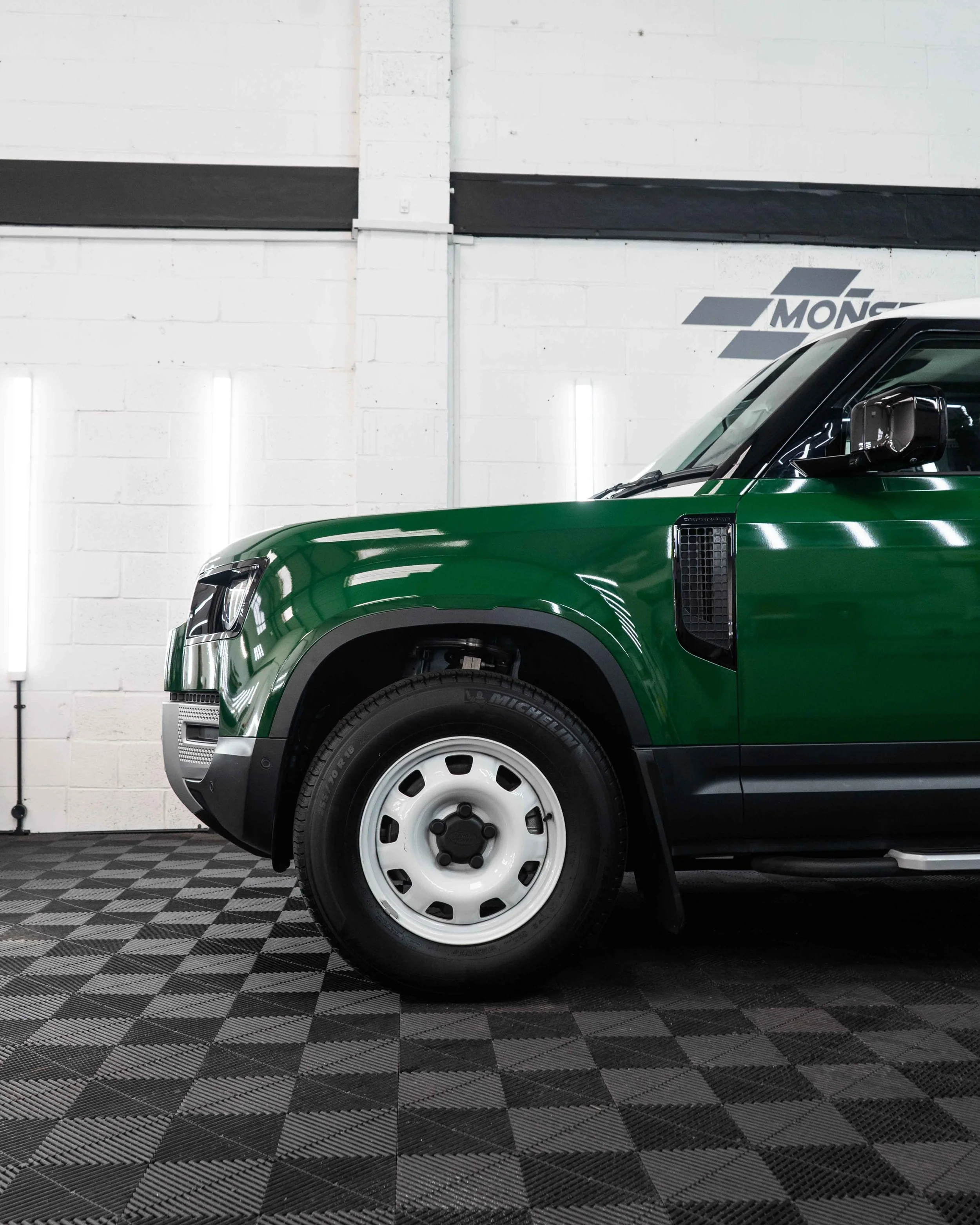 Land Rover Defender 90 full colour change vinyl wrap in Gloss Dark Green