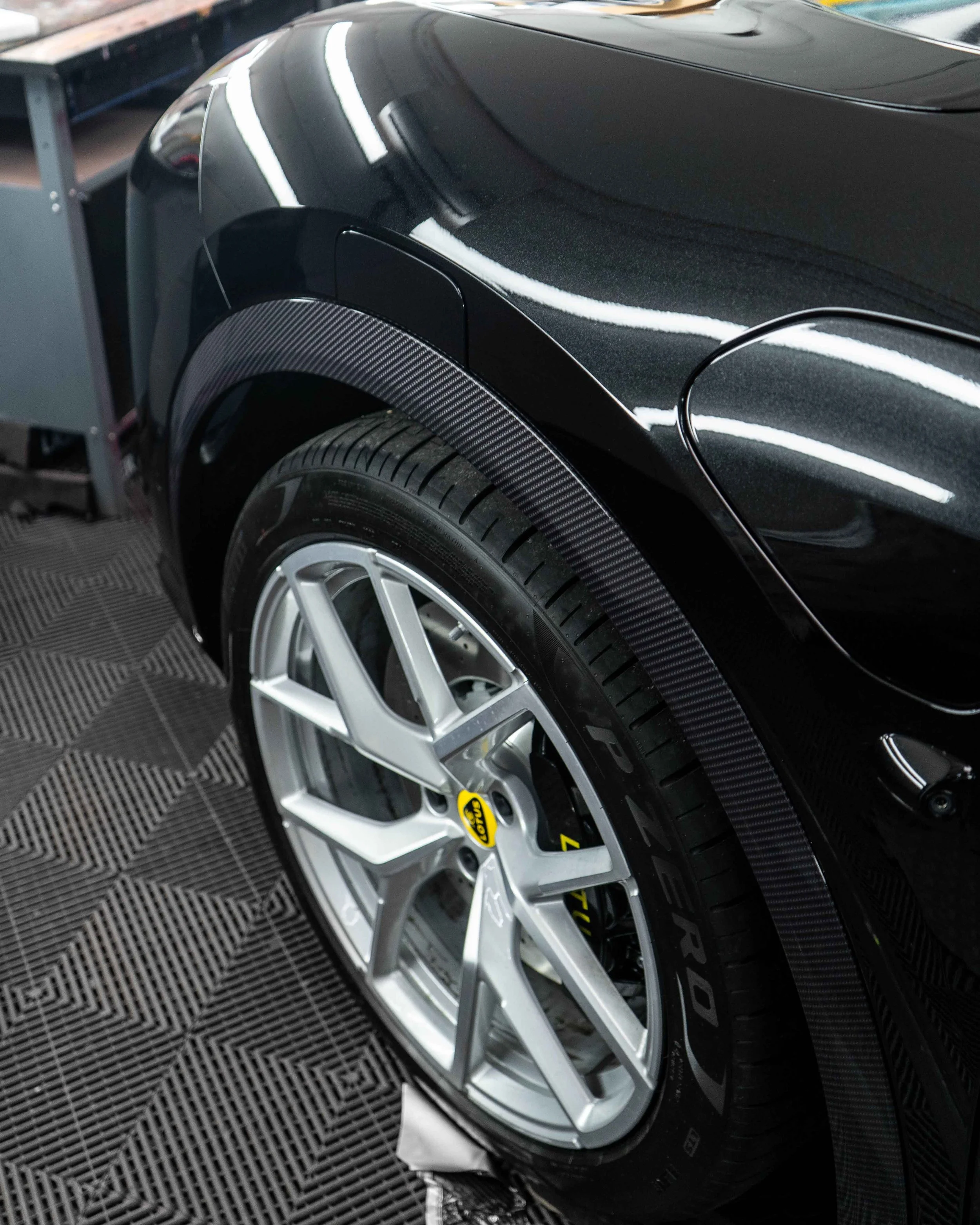 Lotus Eletre lower trims, spoiler, wing mirrors and bonnet wrapped in 3M Gloss Metallic Carbon Fibre wrapping film. Protected with a Ceramic coating.