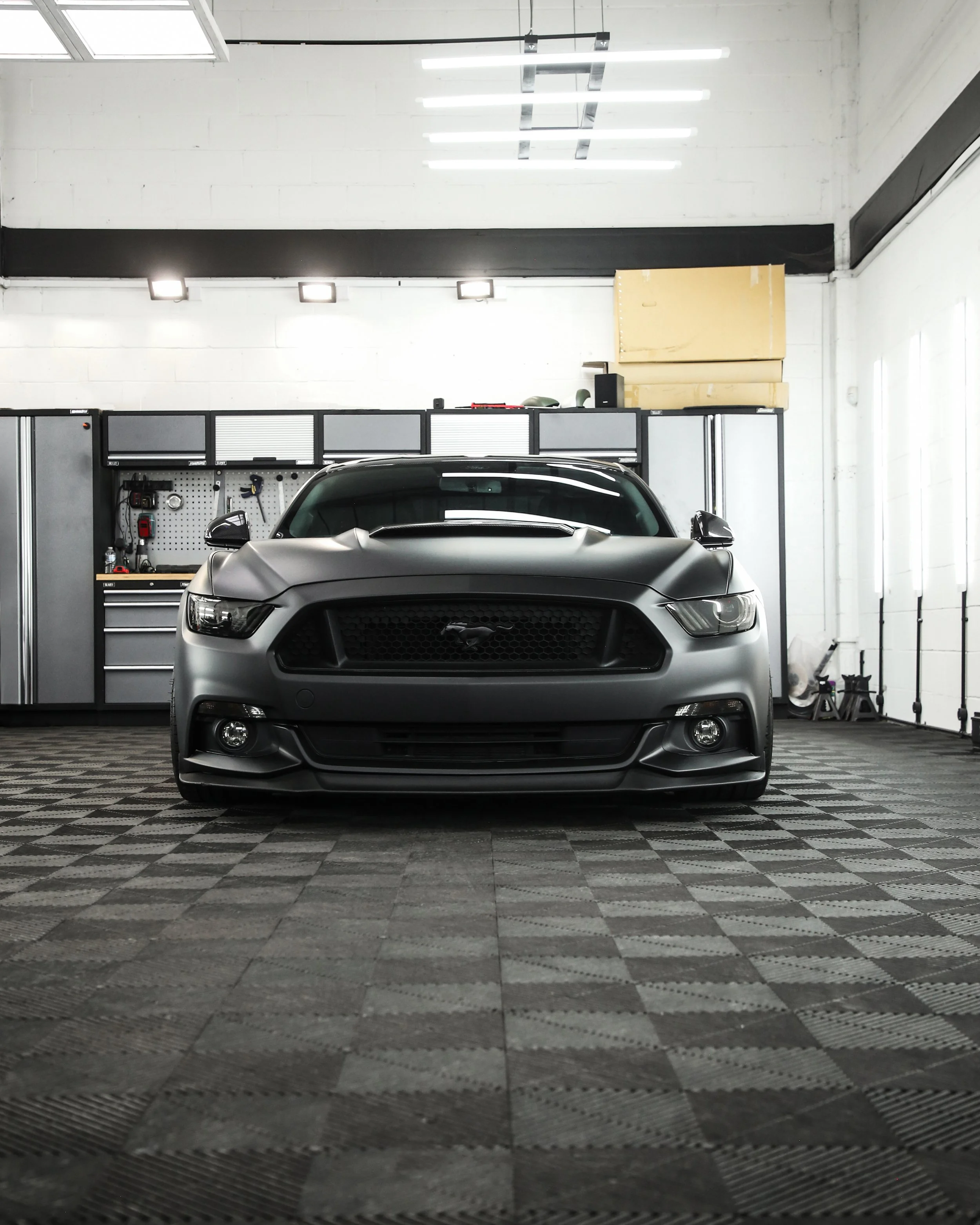 ford mustang GT full external wrap in 3M matte deep black, with carbon fibre styling, window tints, light tints, ceramic coating and caliper painting/
