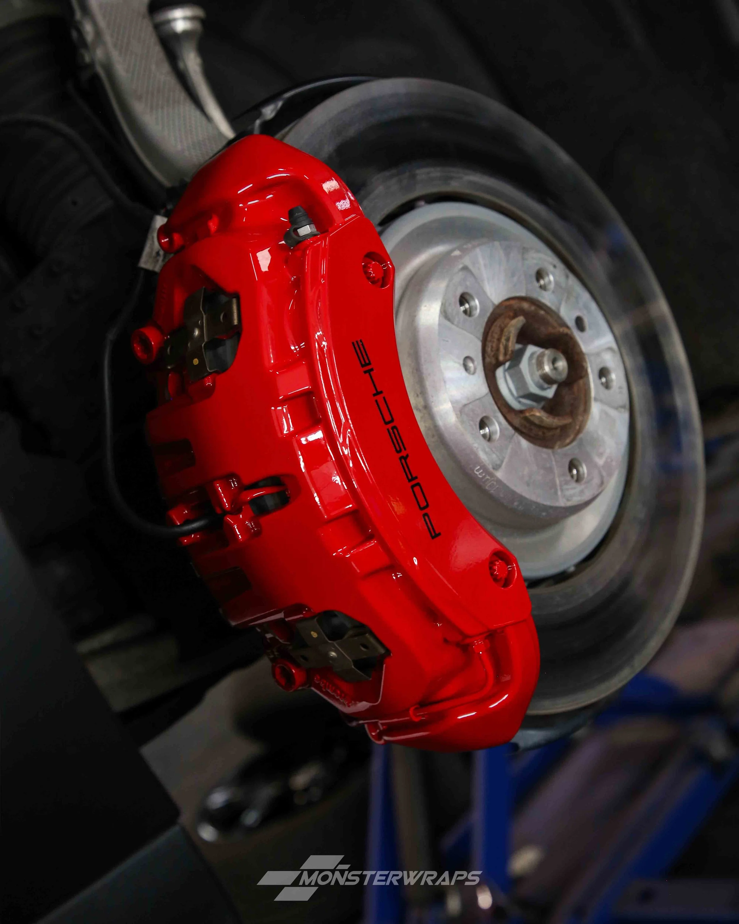 porsche taycan turbo s brake calipers painted in gloss red