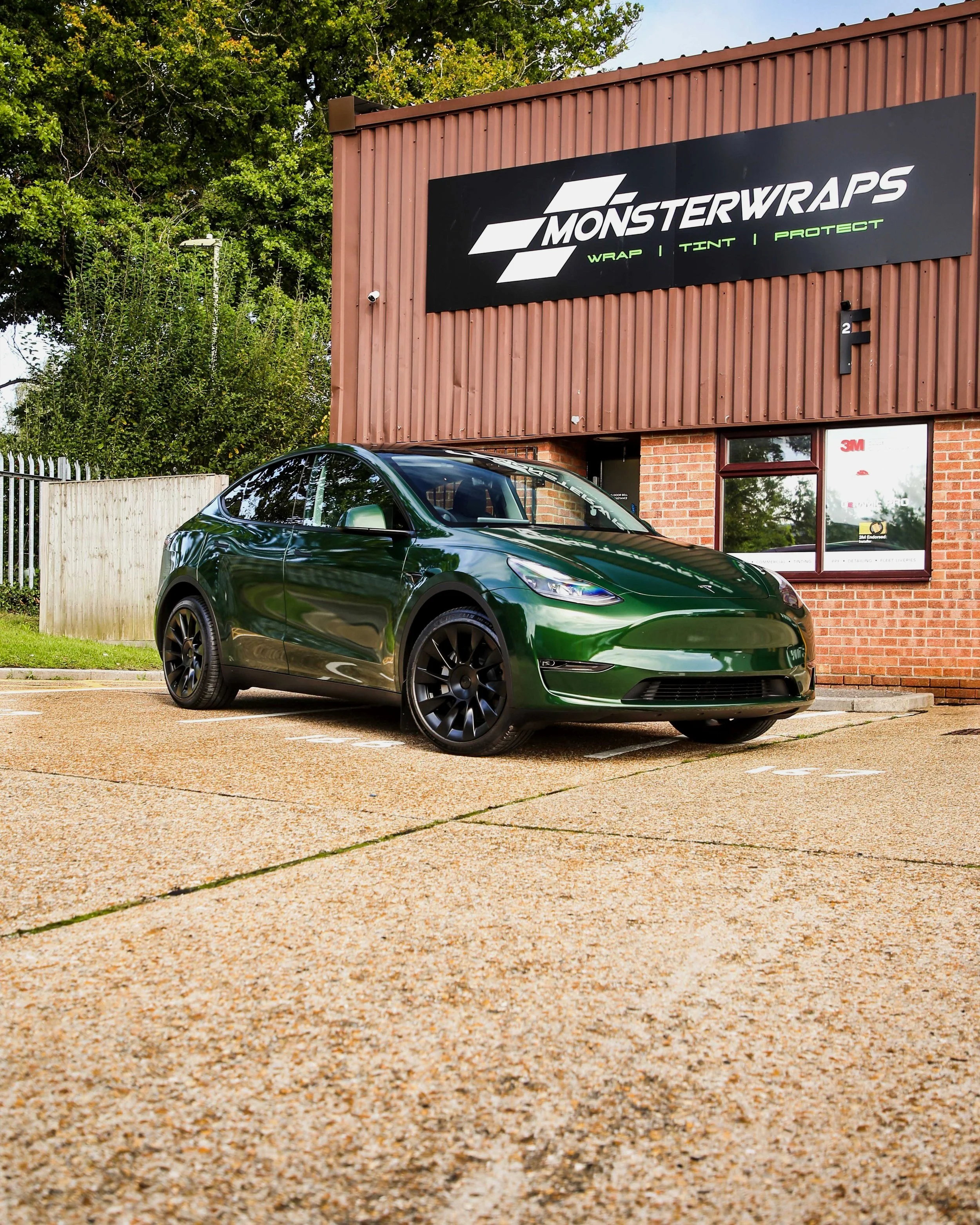Tesla Model Y full external wrap in Gloss Sherwood Green from hexis