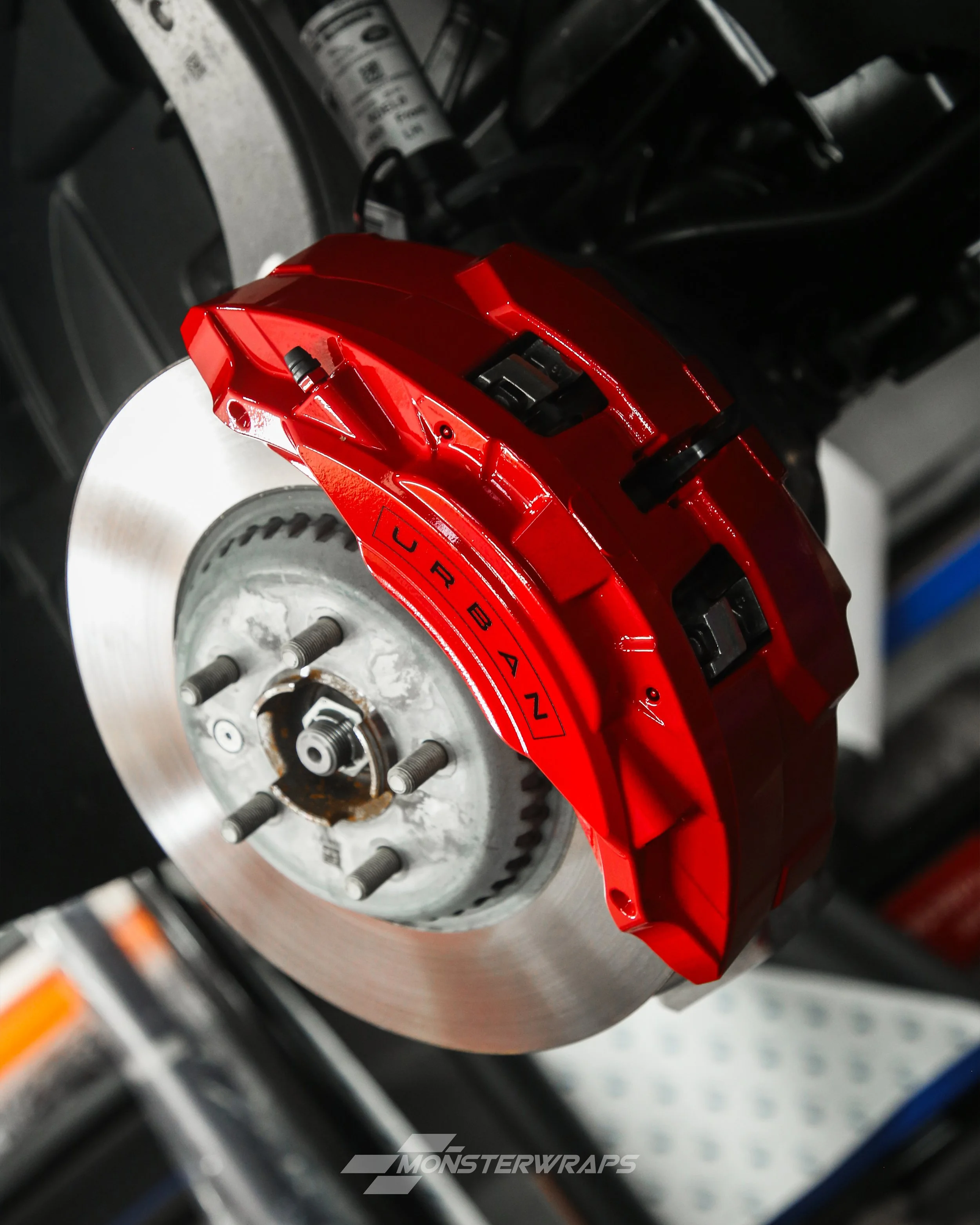 land rover defender 90 brake calipers painted in gloss bright red with gloss black urban automotive caliper stickers decals