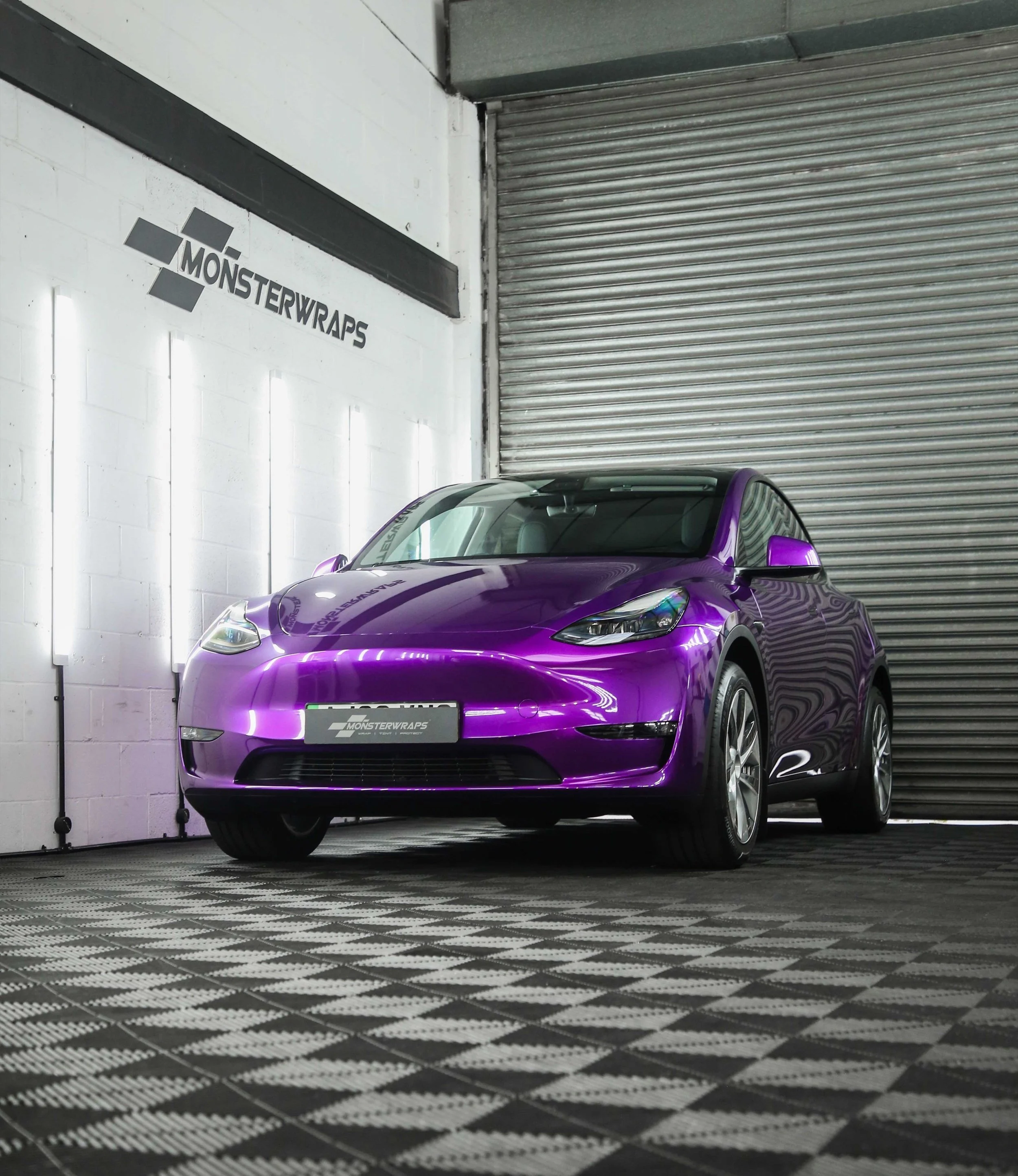 Tesla Model Y full external colour change vinyl wrap in Teckwrap Gloss Candy Purple