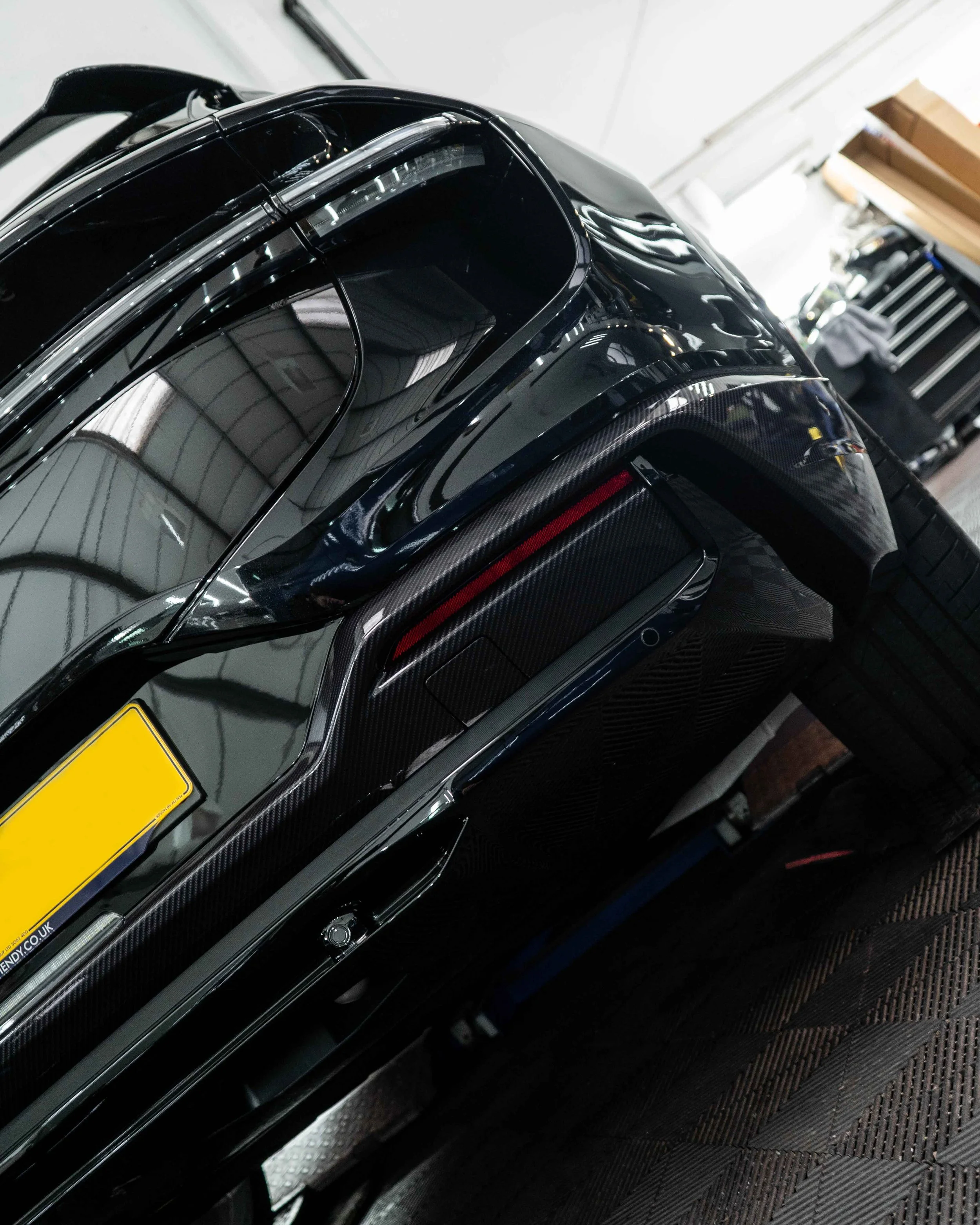 Lotus Eletre lower trims, spoiler, wing mirrors and bonnet wrapped in 3M Gloss Metallic Carbon Fibre wrapping film. Protected with a Ceramic coating.