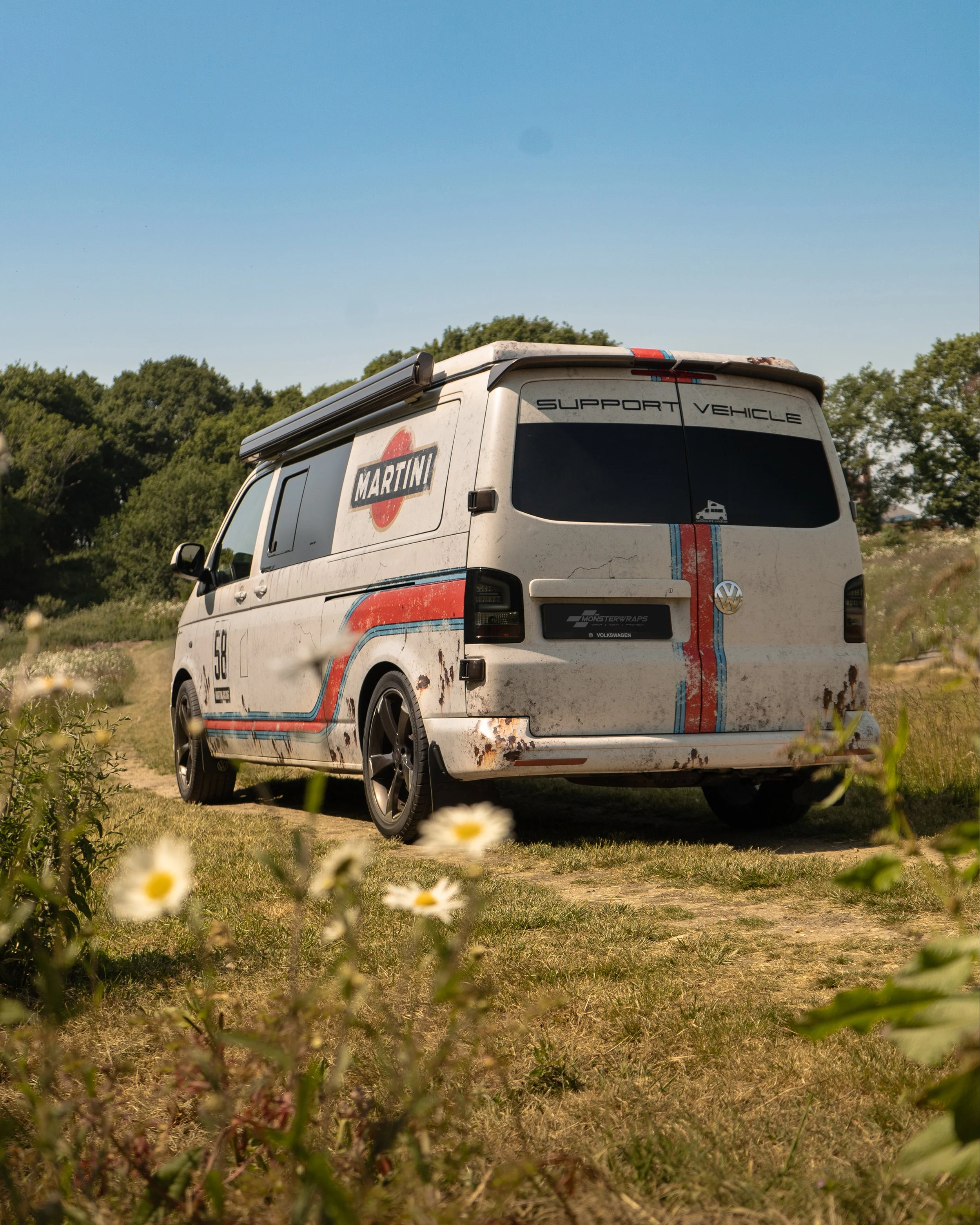 vw transporter T5 T6 camper fully wrapped in a custom designed weathered martini racing livery