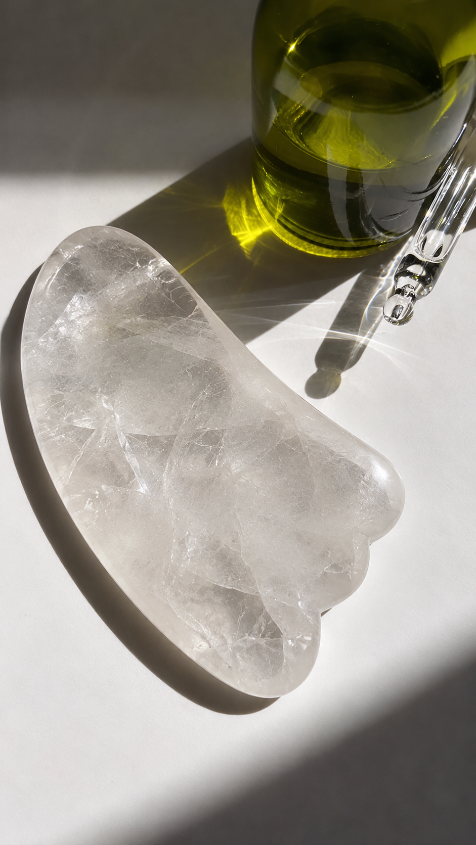 Clear Quartz Gua Sha in Sunlight.png