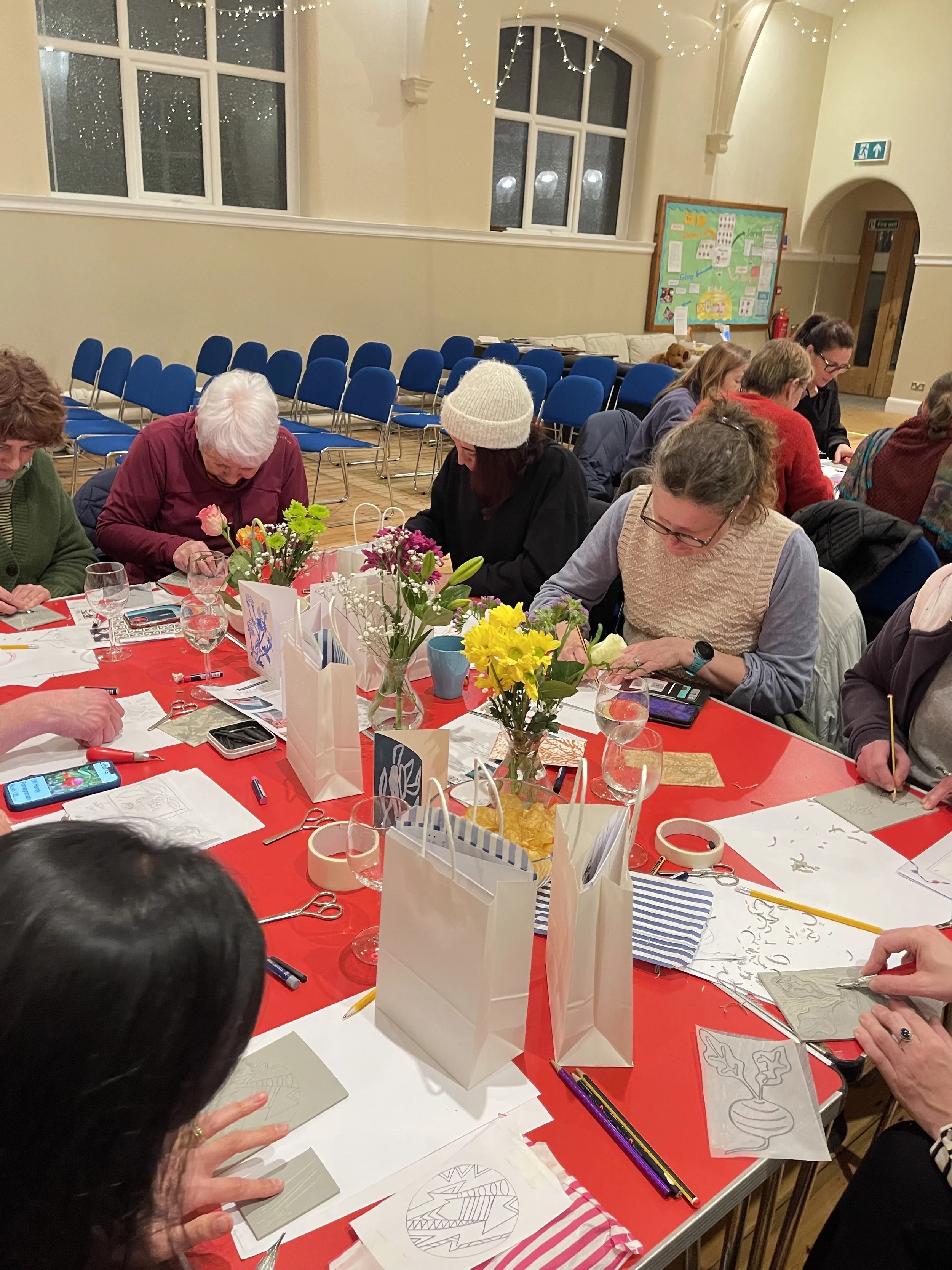 People at red tables carving.jpg (Copy) (Copy)